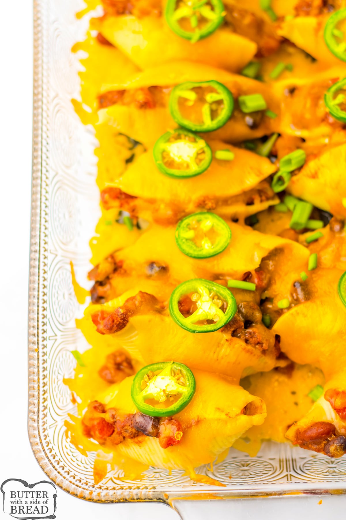 Chili Cheese Stuffed Shells are made with canned chili, ground beef, and lots of veggies. A quick, easy, weeknight meal that is ready in less than 30 minutes!