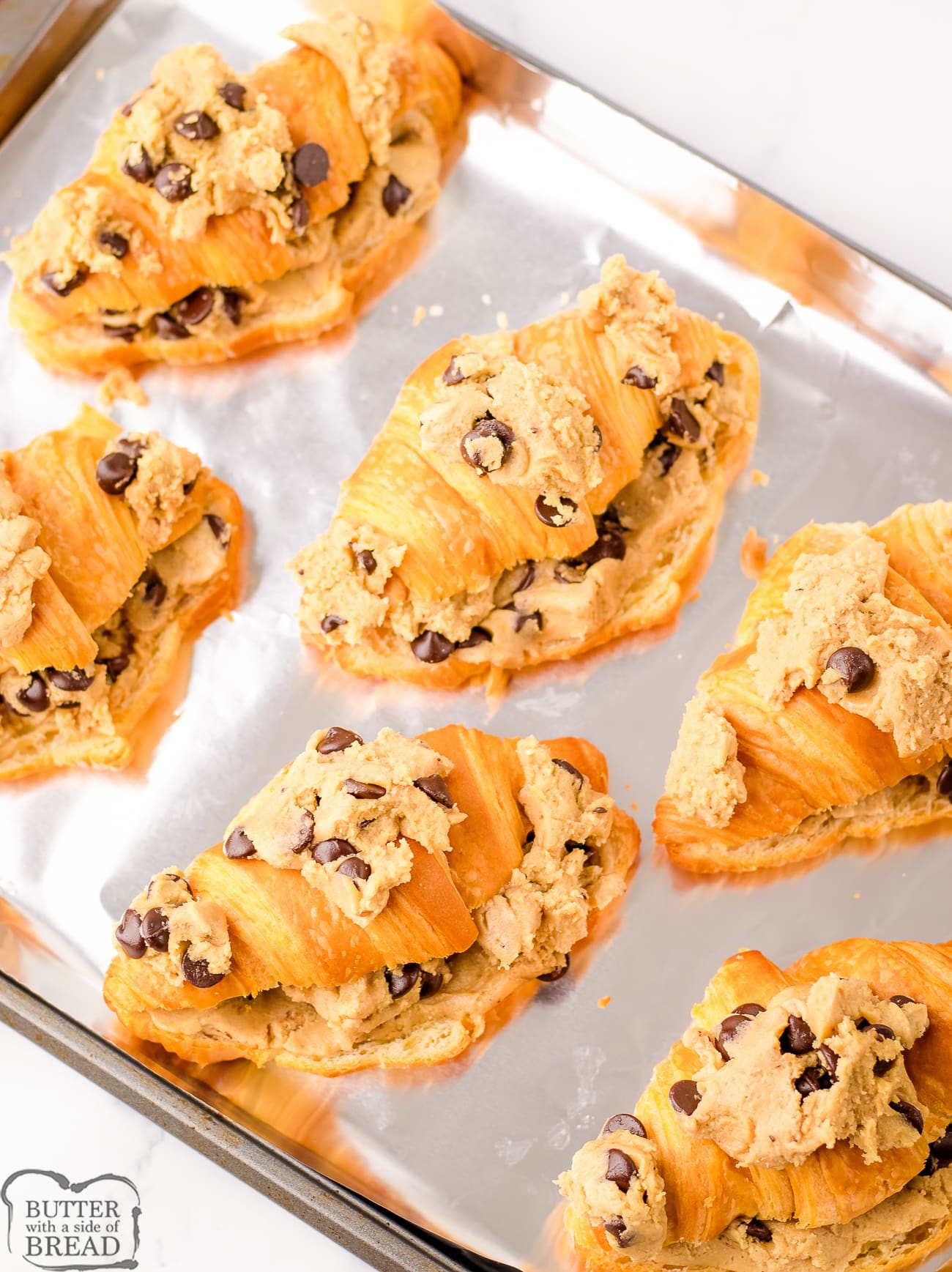 cookie dough croissants on a baking sheet