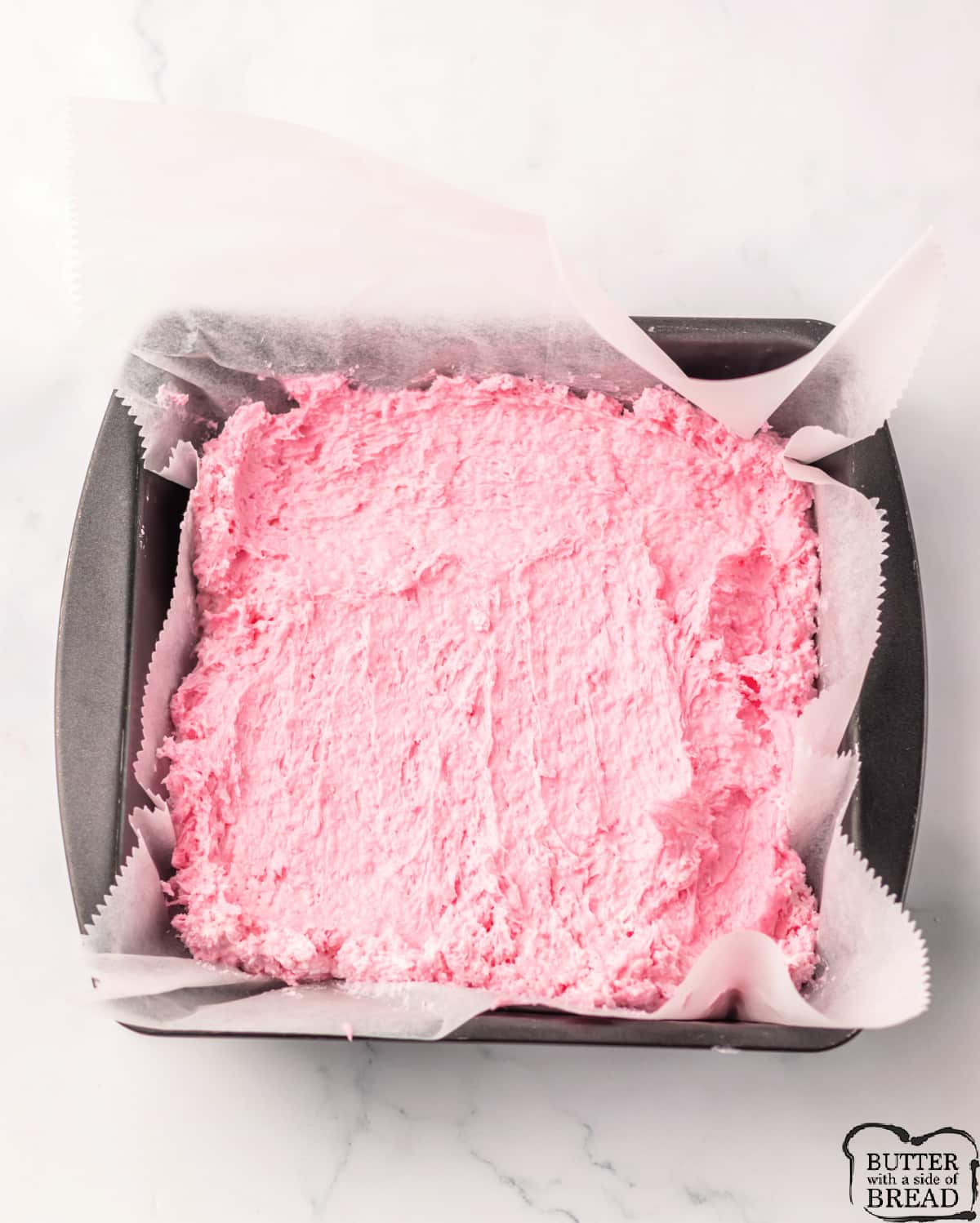Pour candy mixture into a square pan lined with parchment paper.