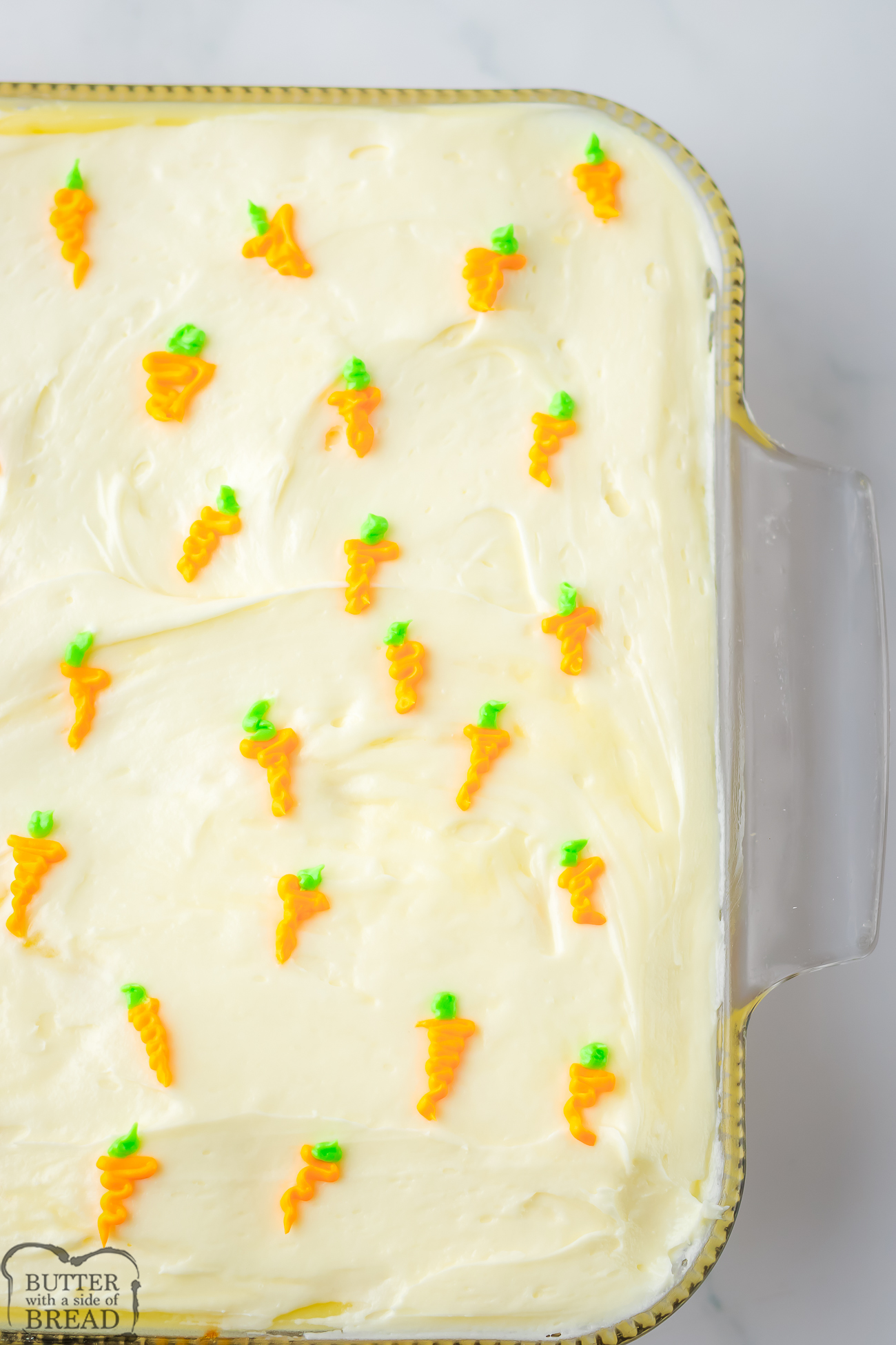 carrot sheet cake with tiny frosting carrots on top