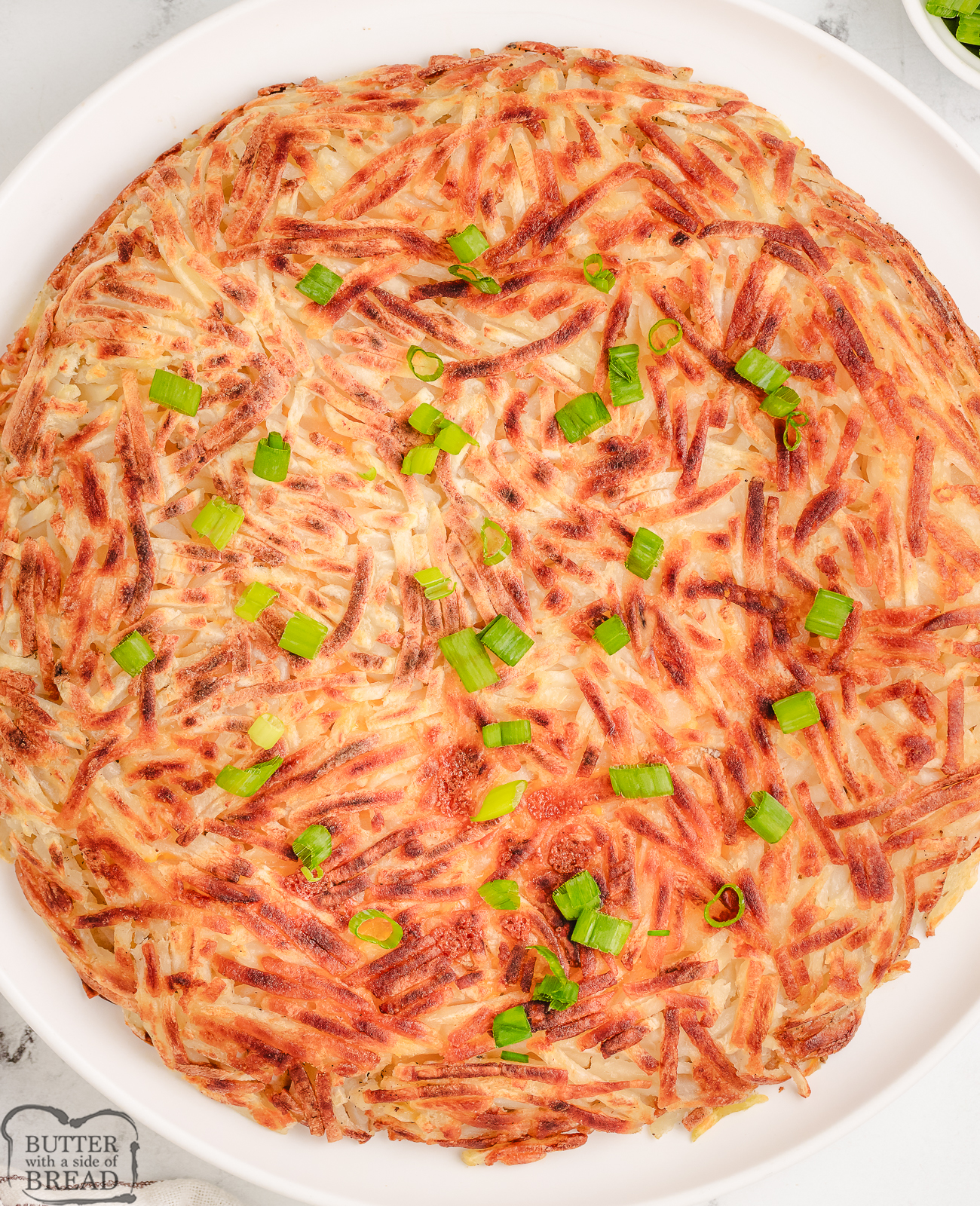 crispy hash browns on a white plate