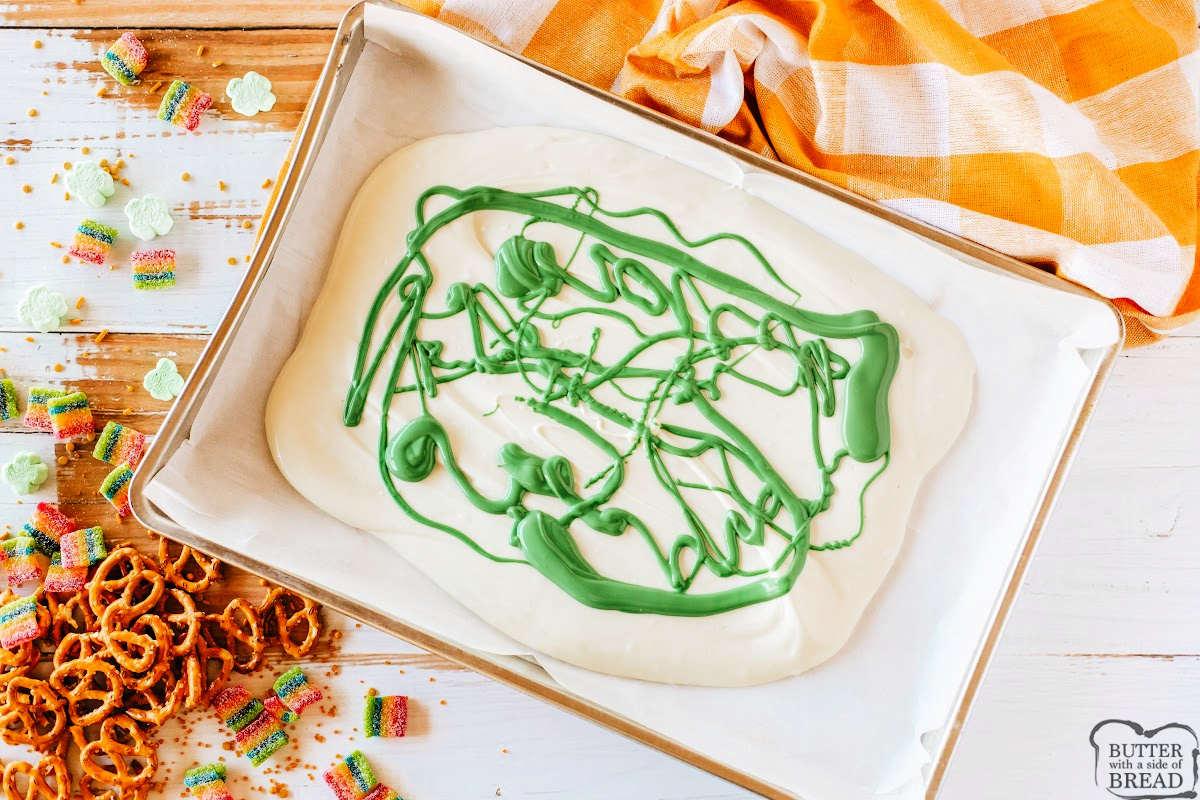 Melted green chocolate on top of the white chocolate.