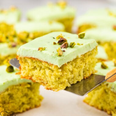 serving up a slice of pistachio pineapple cake