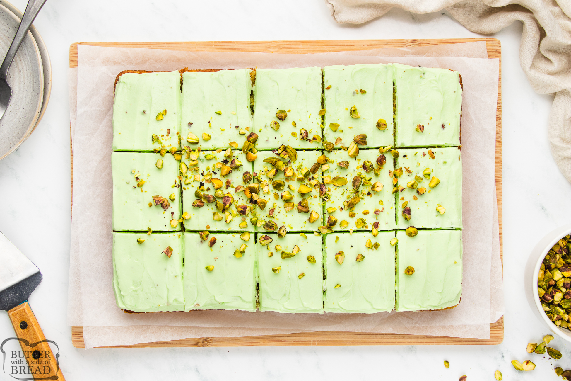 pistachio and pineapple sheet cake cut into squares