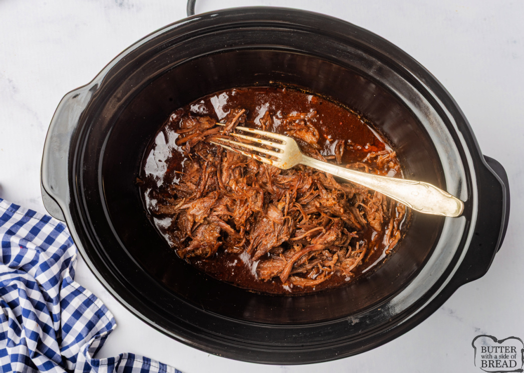 Shredded brisket with BBQ sauce.