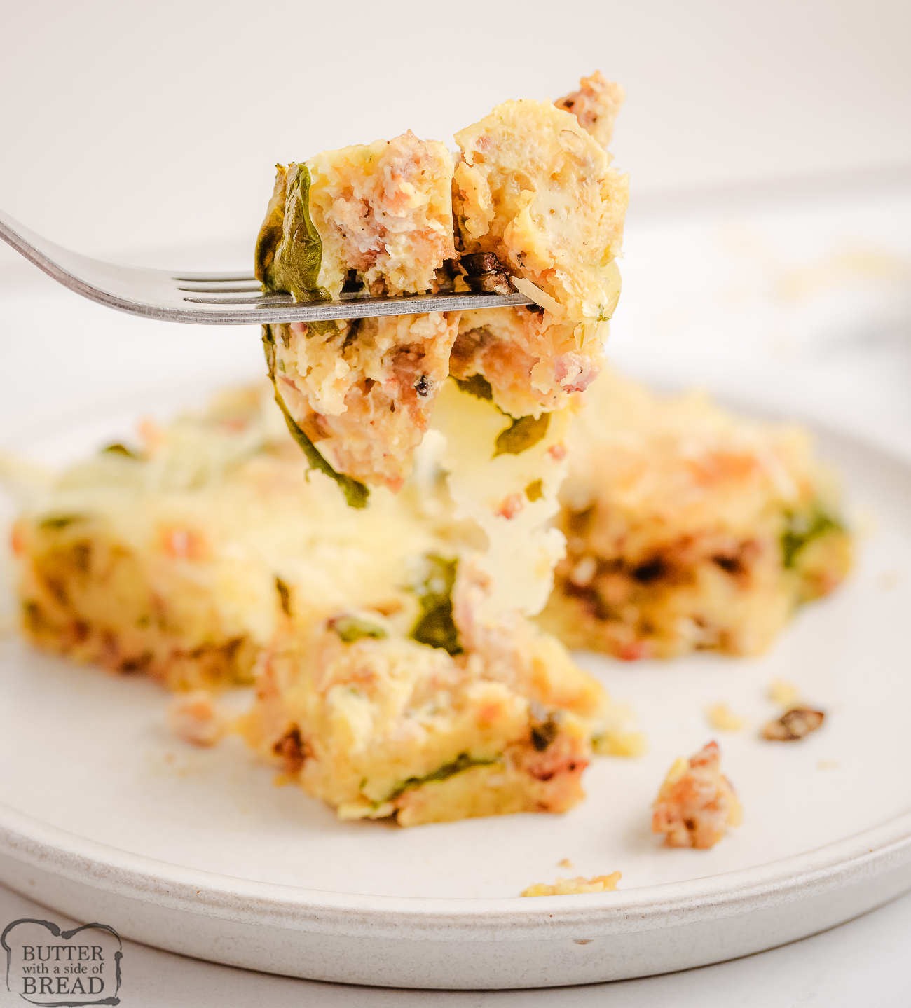 bite of Egg Sausage Spinach Casserole on a fork