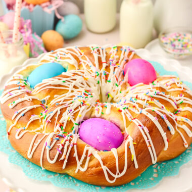 Easter Bread on a white platter with colored eggs