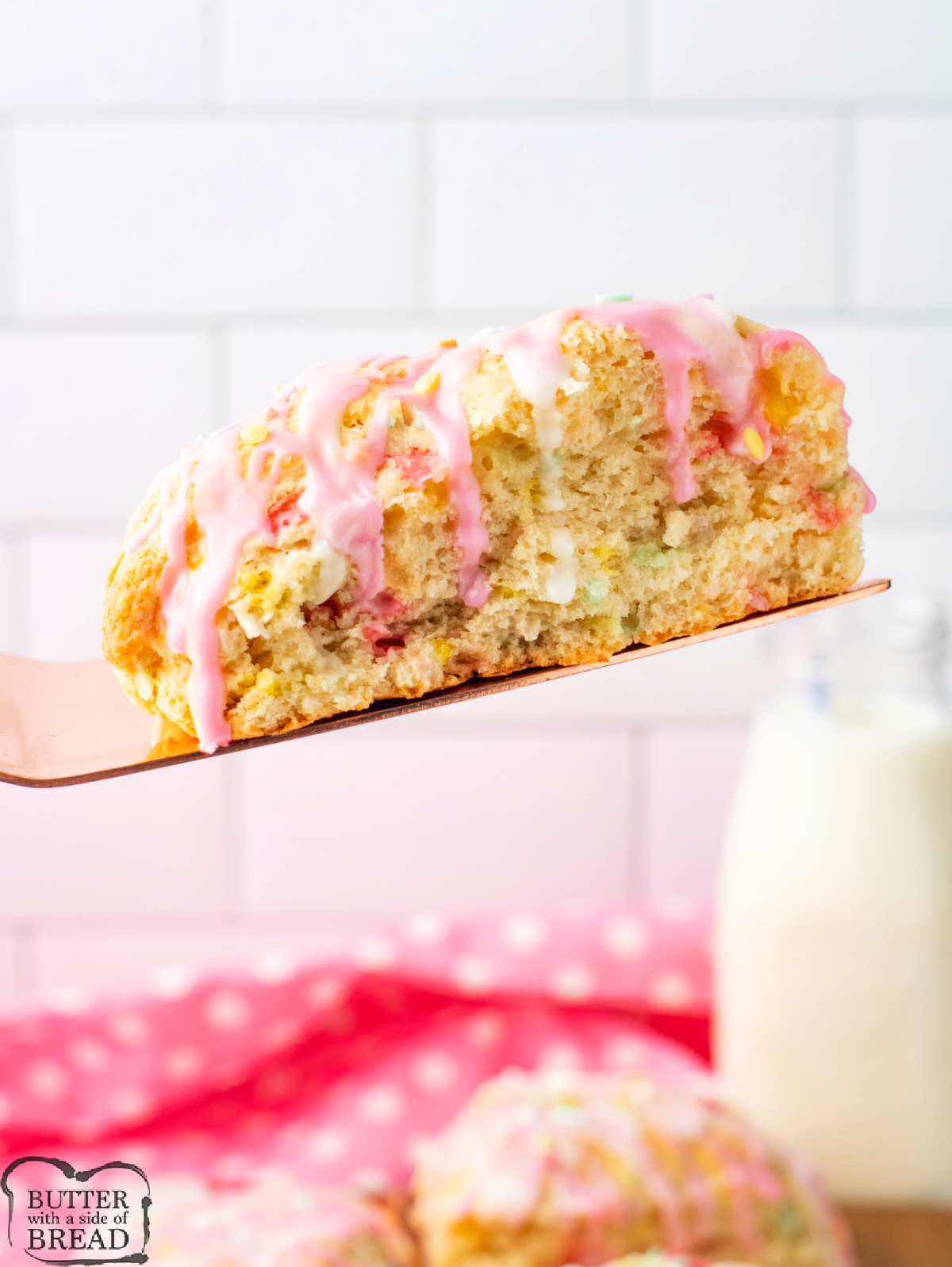 Vanilla scone with sprinkles and glaze.