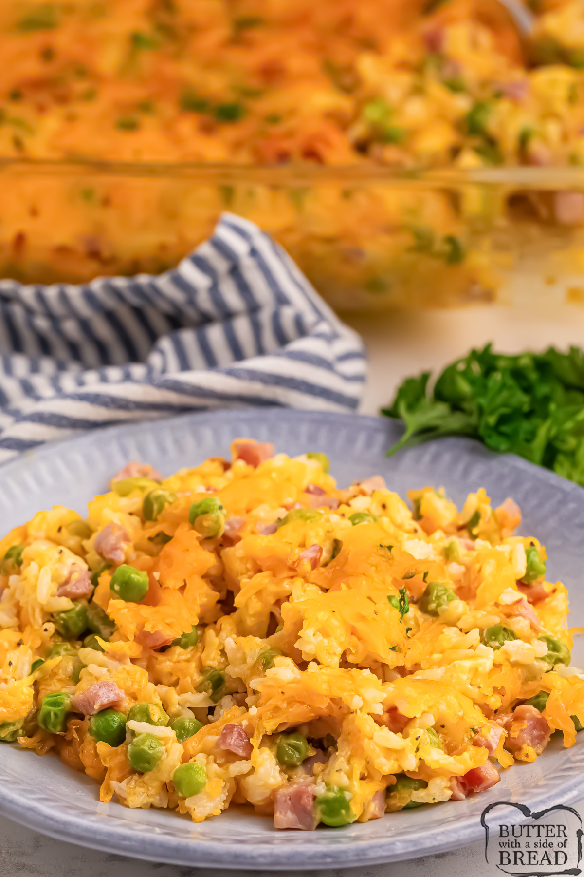 Casserole made with cheese, rice, ham, and peas.