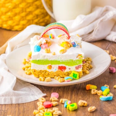 layered Lucky Charms dessert lush with a candy rainbow top