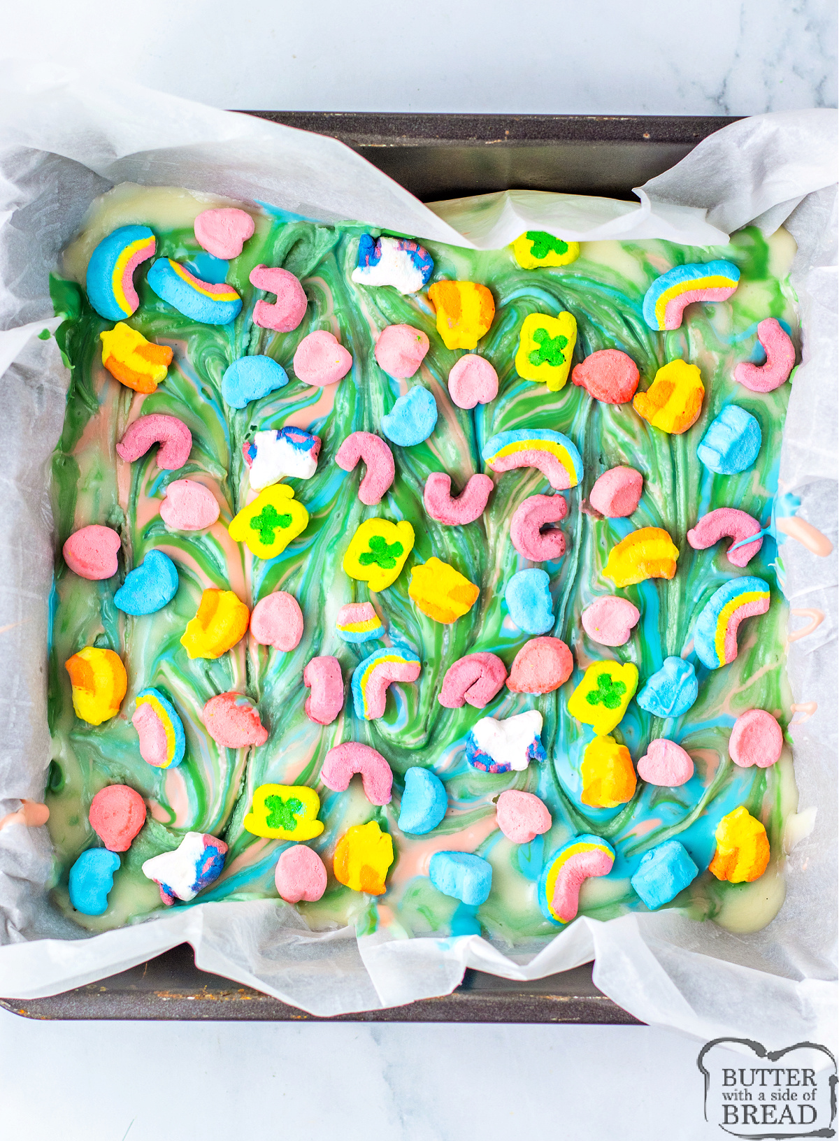 Sprinkle Lucky Charms marshmallows on top of rainbow fudge recipe.