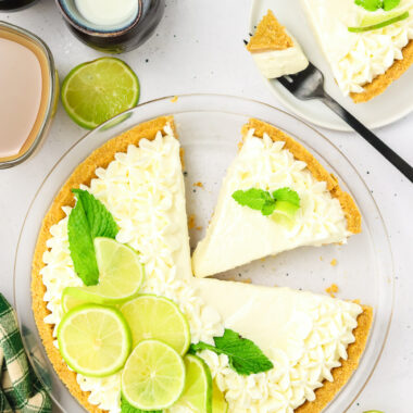 key lime pie with slices cut out
