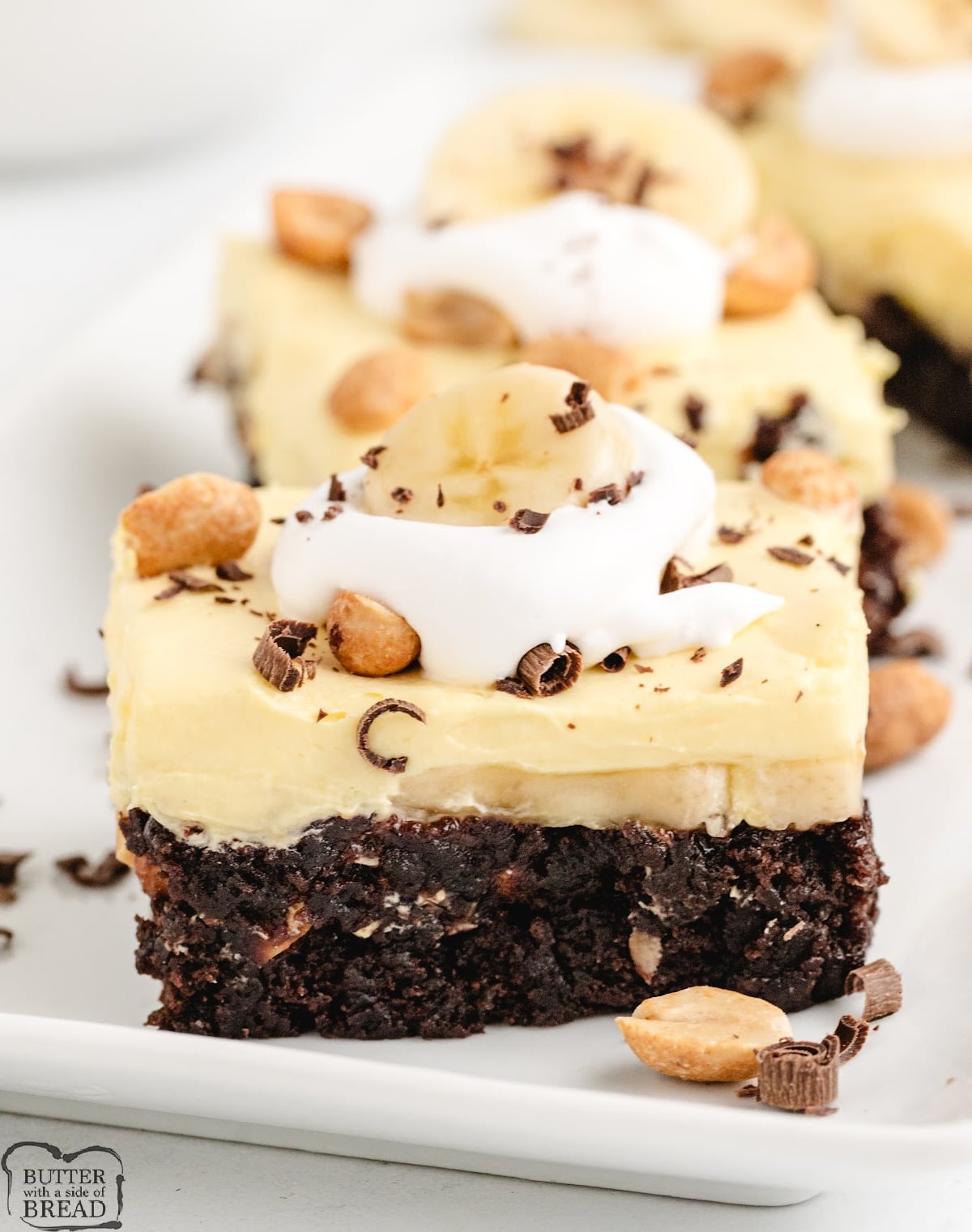 Brownies topped with vanilla pudding layer. 