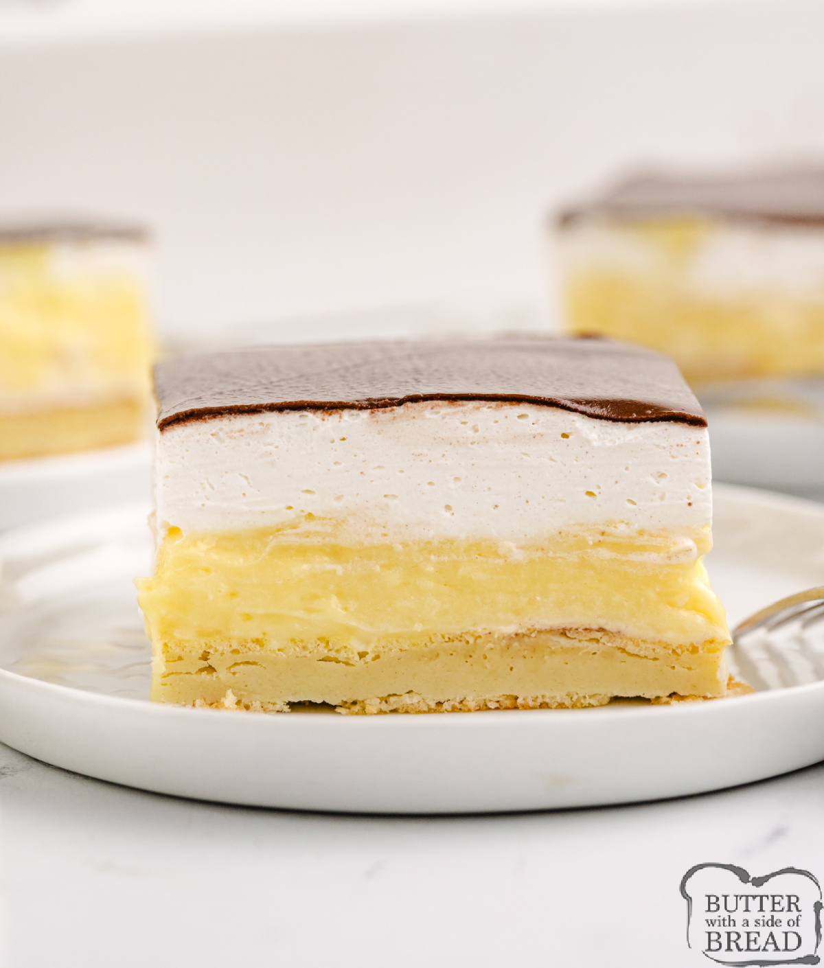 Easy Chocolate Eclair Cake has a pastry crust, creamy custard filling, and rich chocolate topping&mdash;perfect no-fuss dessert for a crowd.