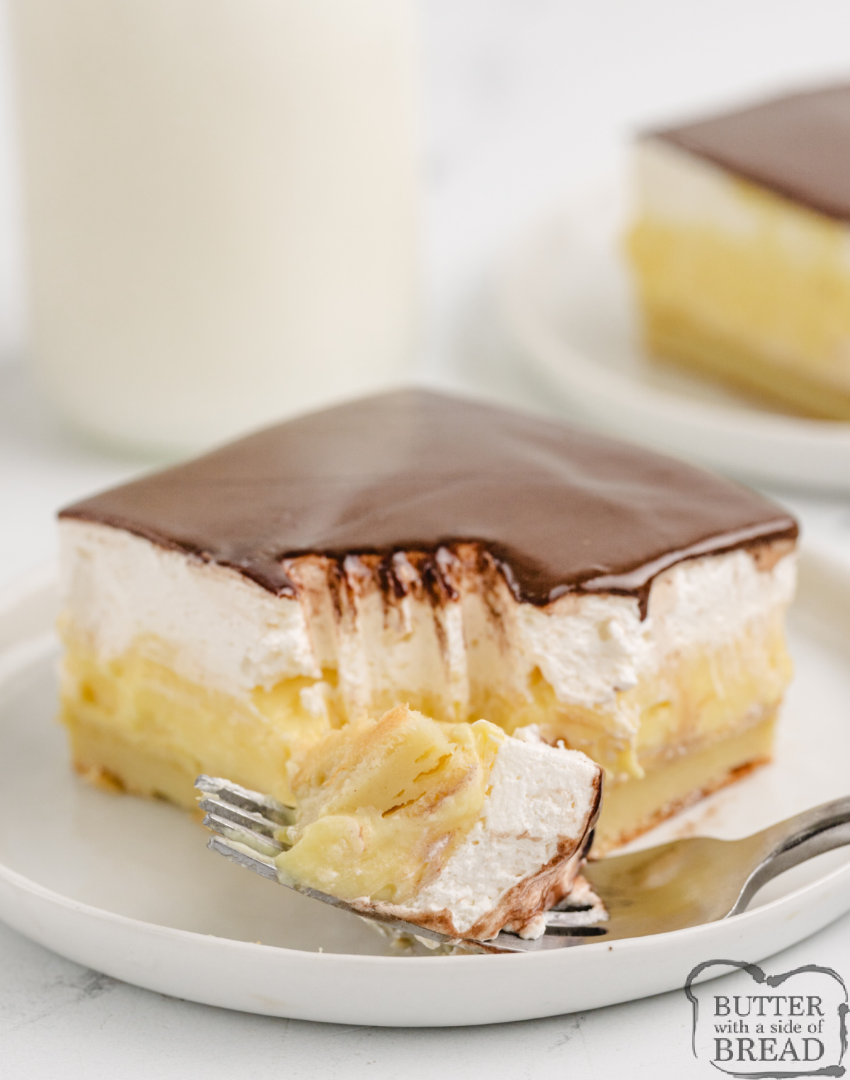 Serving of layered pudding and chocolate dessert. 