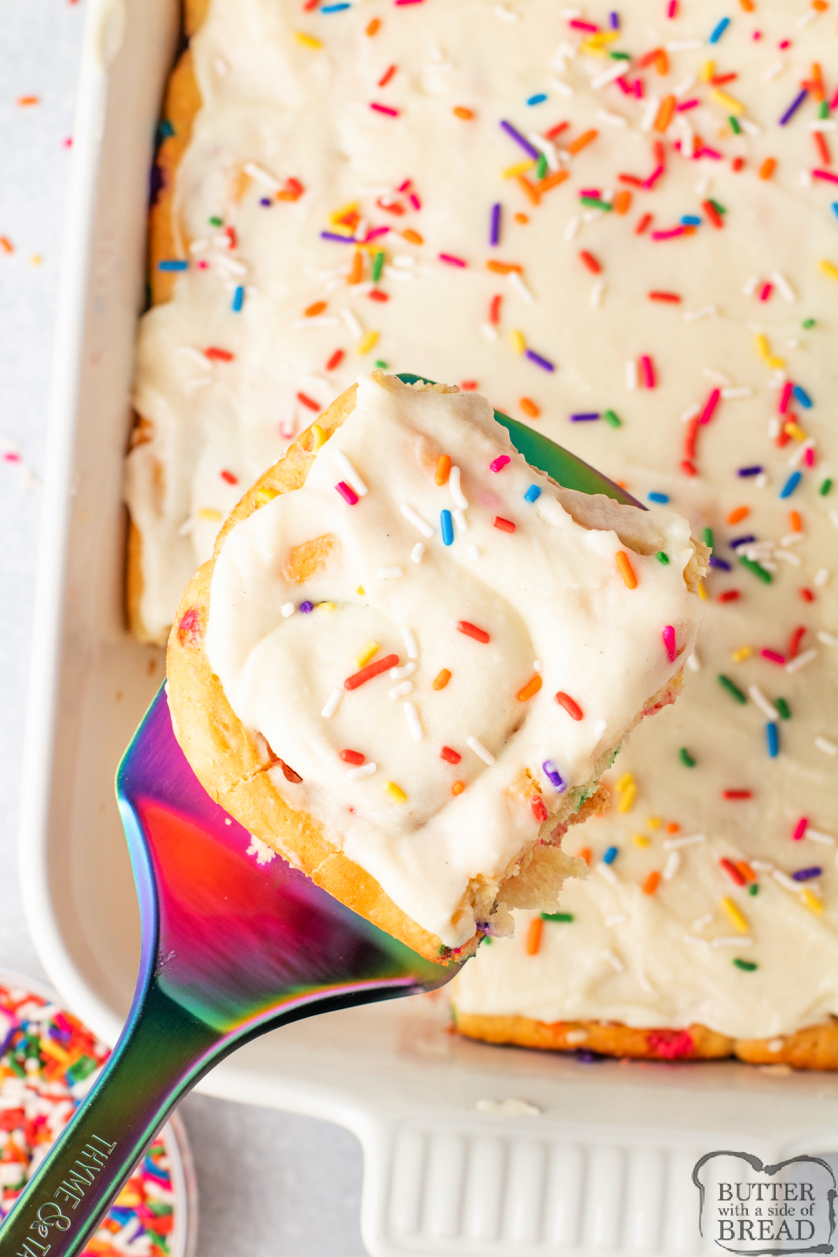 Serving a funfetti cinnamon roll.
