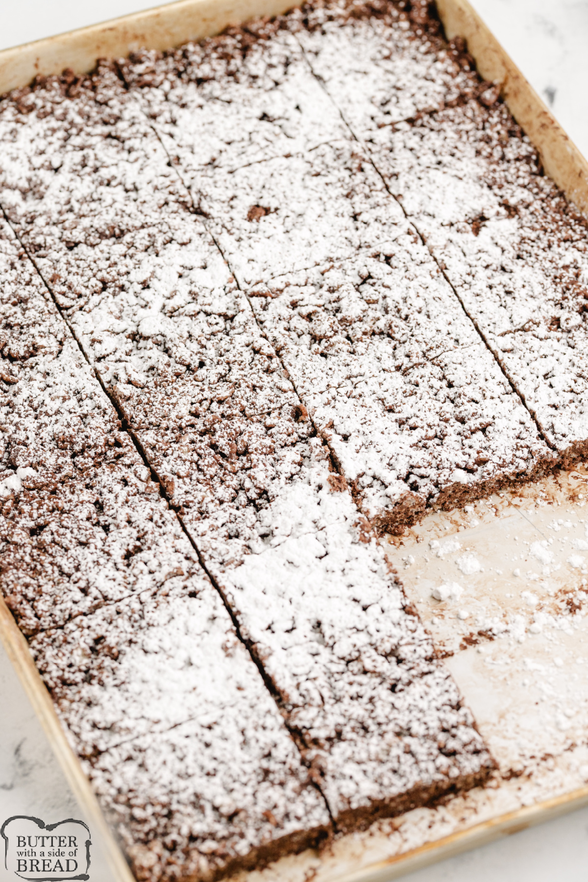 These no-bake Muddy Buddy Rice Krispie Treats are packed with peanut butter, chocolate, and powdered sugar. Easy to make, fun to slice, and totally irresistible!