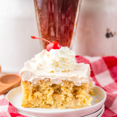 root beer poke cake with a root beer float behind it