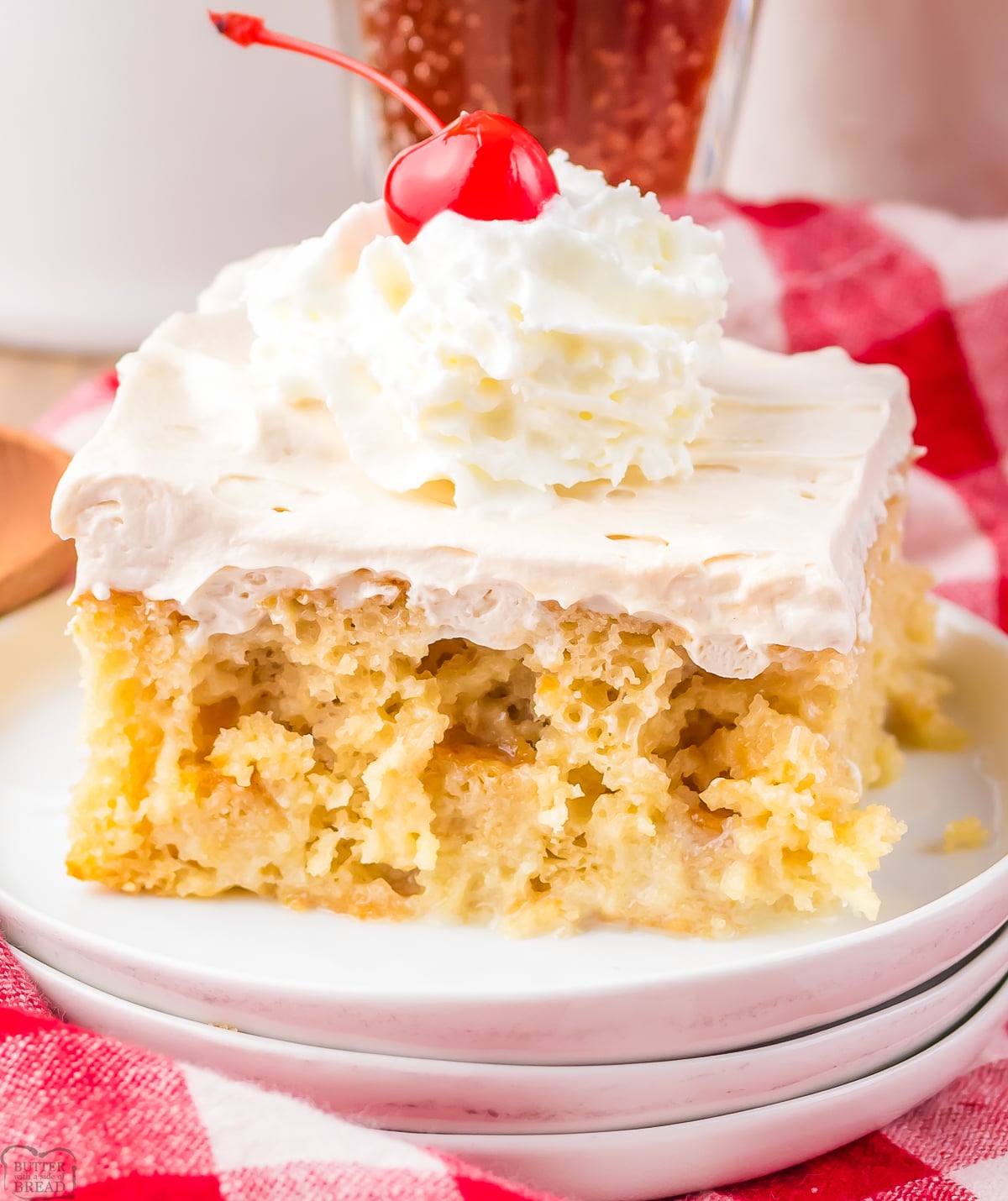 slice of root beer float poke cake on a white plate