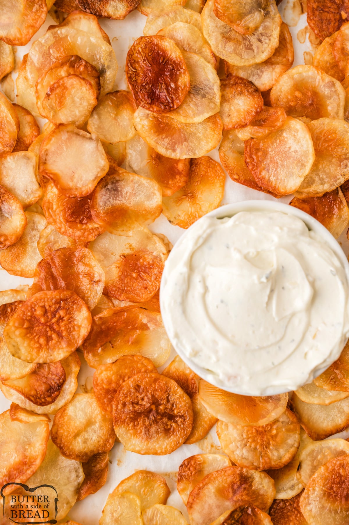 Homemade potato chips with ranch dip.