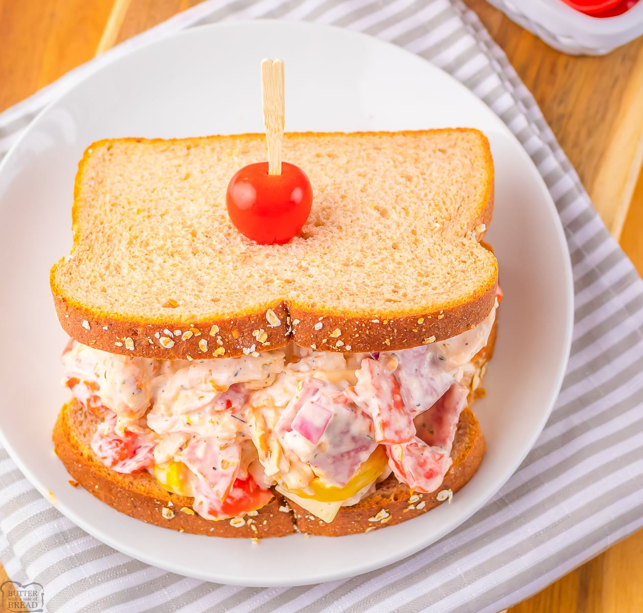 Italian Grinder chicken salad with pepperoni, salami and chicken with peppers on sliced wheat bread