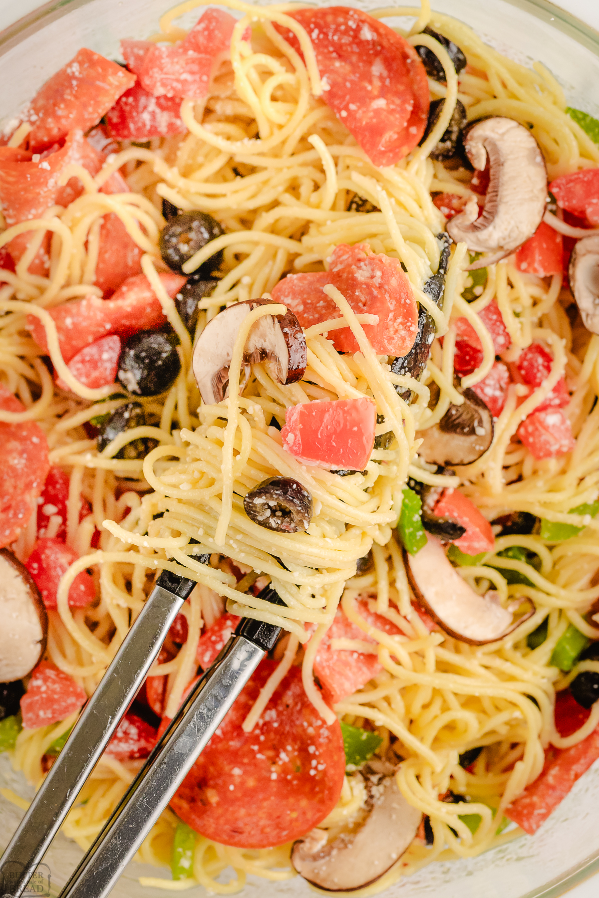 serving up pizza pasta with tongs