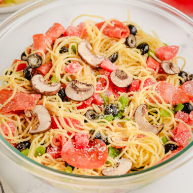 bowl of pizza pasta dinner with pepperoni and cheese