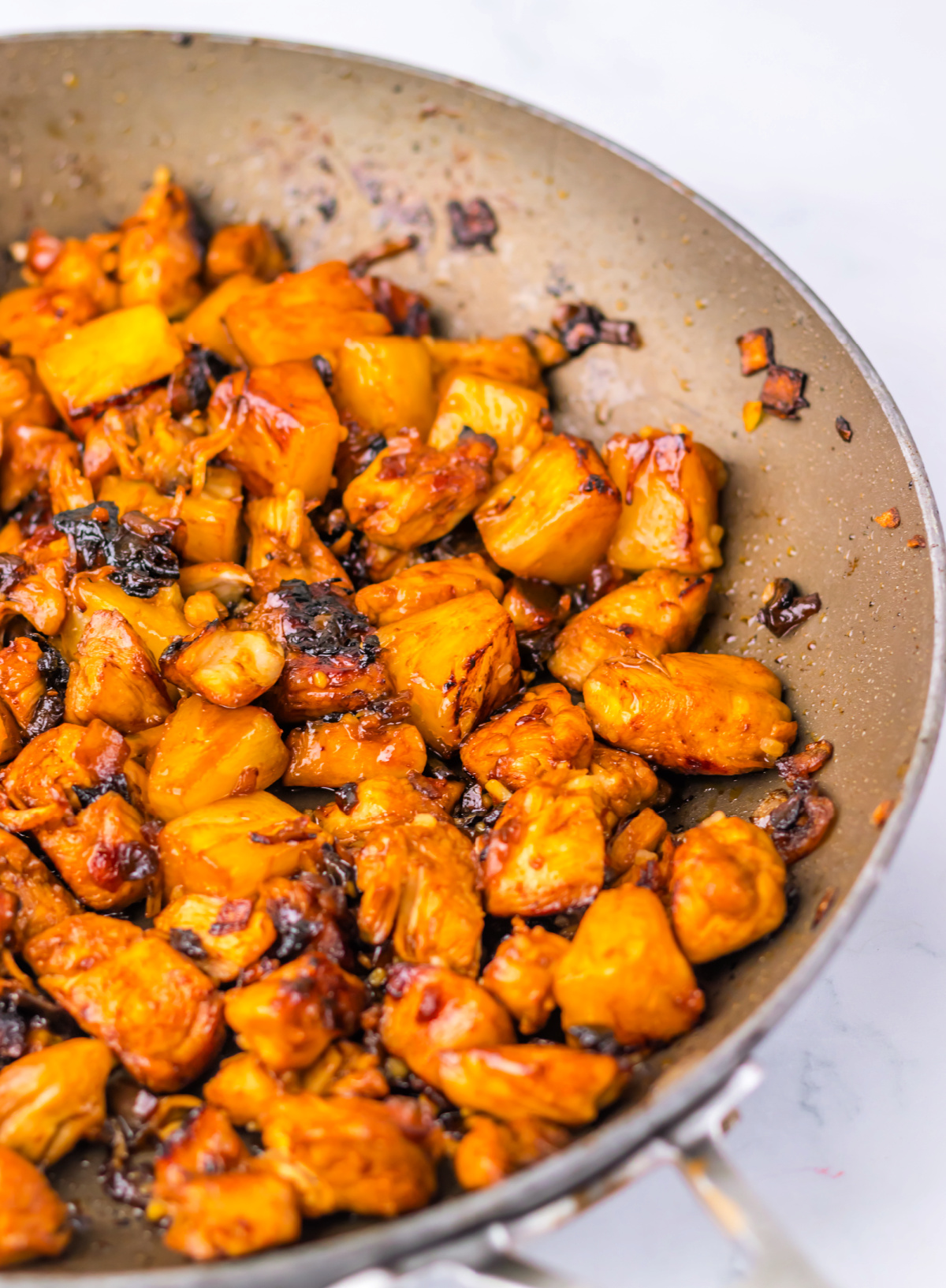 Spicy Pineapple Brown Sugar Chicken is a bold, sweet and spicy 20-minute dinner with juicy chicken, pineapple chunks, and a sticky glaze.