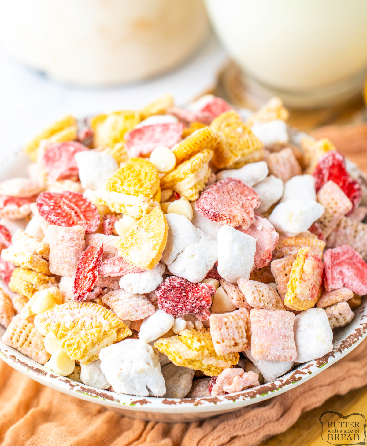 Strawberry Shortcake Muddy Buddies are a sweet, crunchy snack mix with Chex, strawberry melts, Oreos, and powdered sugar—ready in 10 mins!
