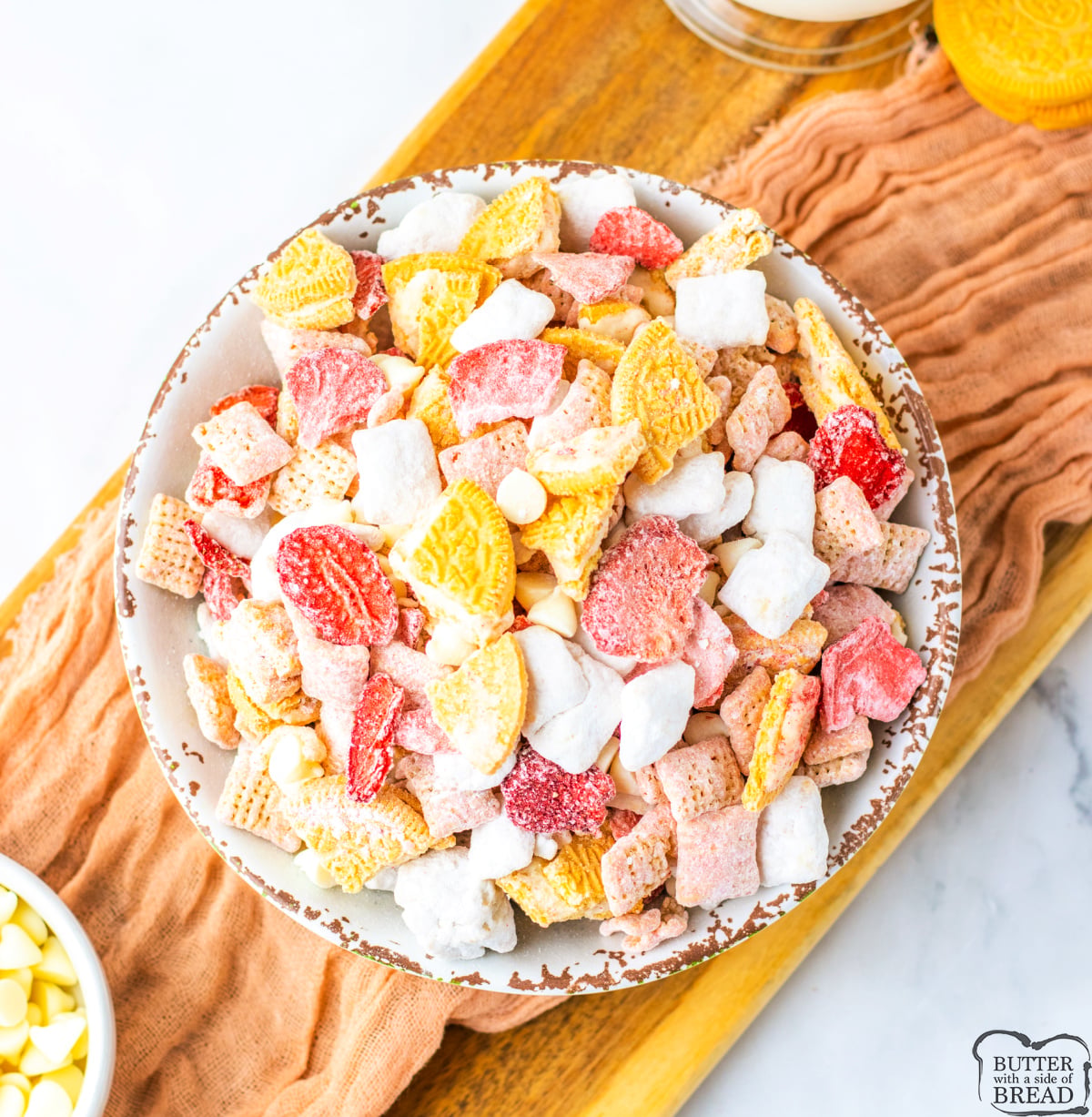 Puppy chow made with Golden Oreos and freeze-dried strawberries.