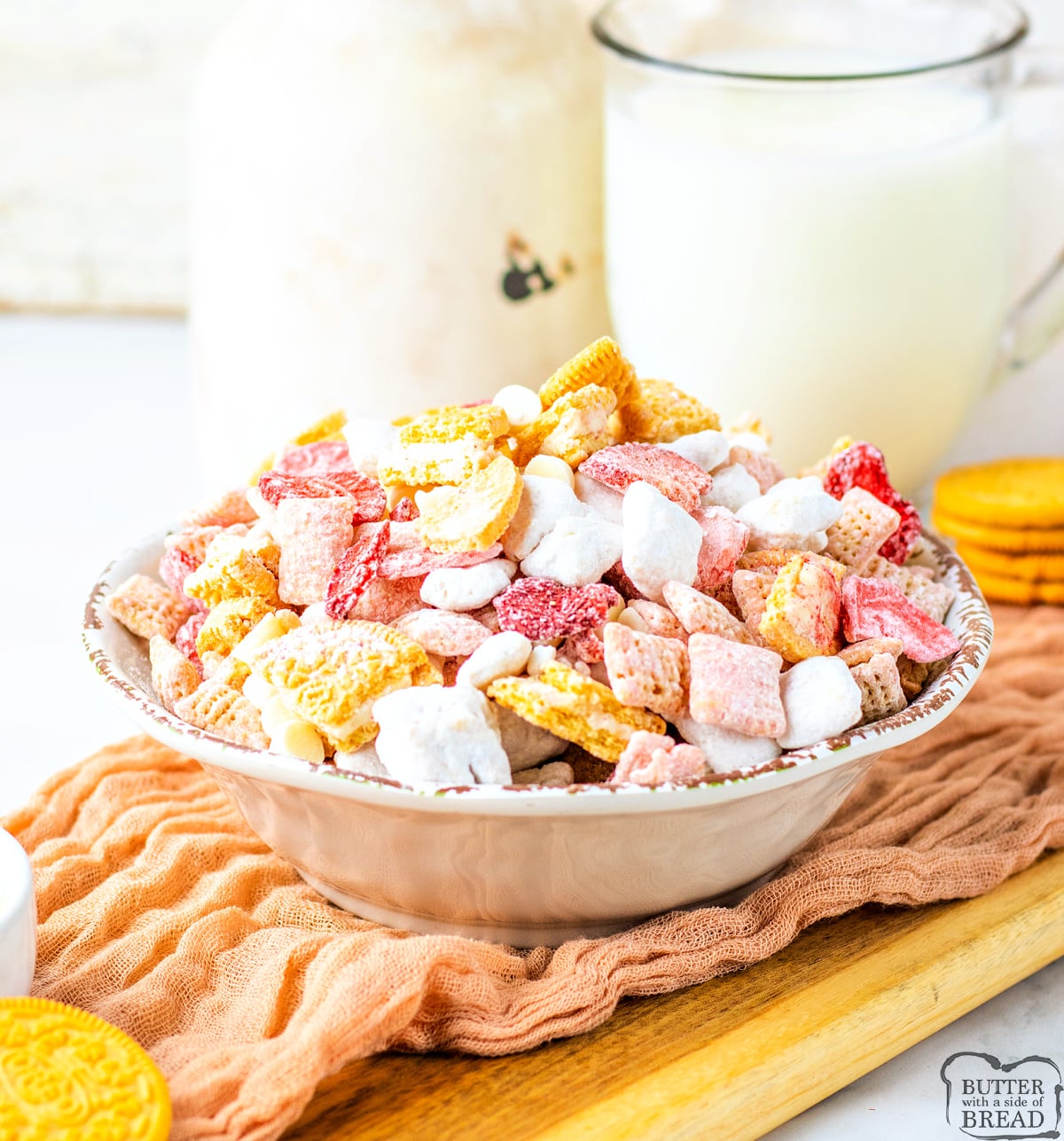 Strawberry Shortcake Muddy Buddies are a sweet, crunchy snack mix with Chex, strawberry melts, Oreos, and powdered sugar—ready in 10 mins!