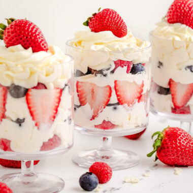 easy white chocolate mousse layered with fresh berries in a parfait glass