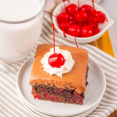 cherry cola brownie on a white plate