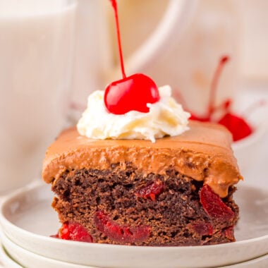 cherry coke brownies topped with whipped cream and a cherry