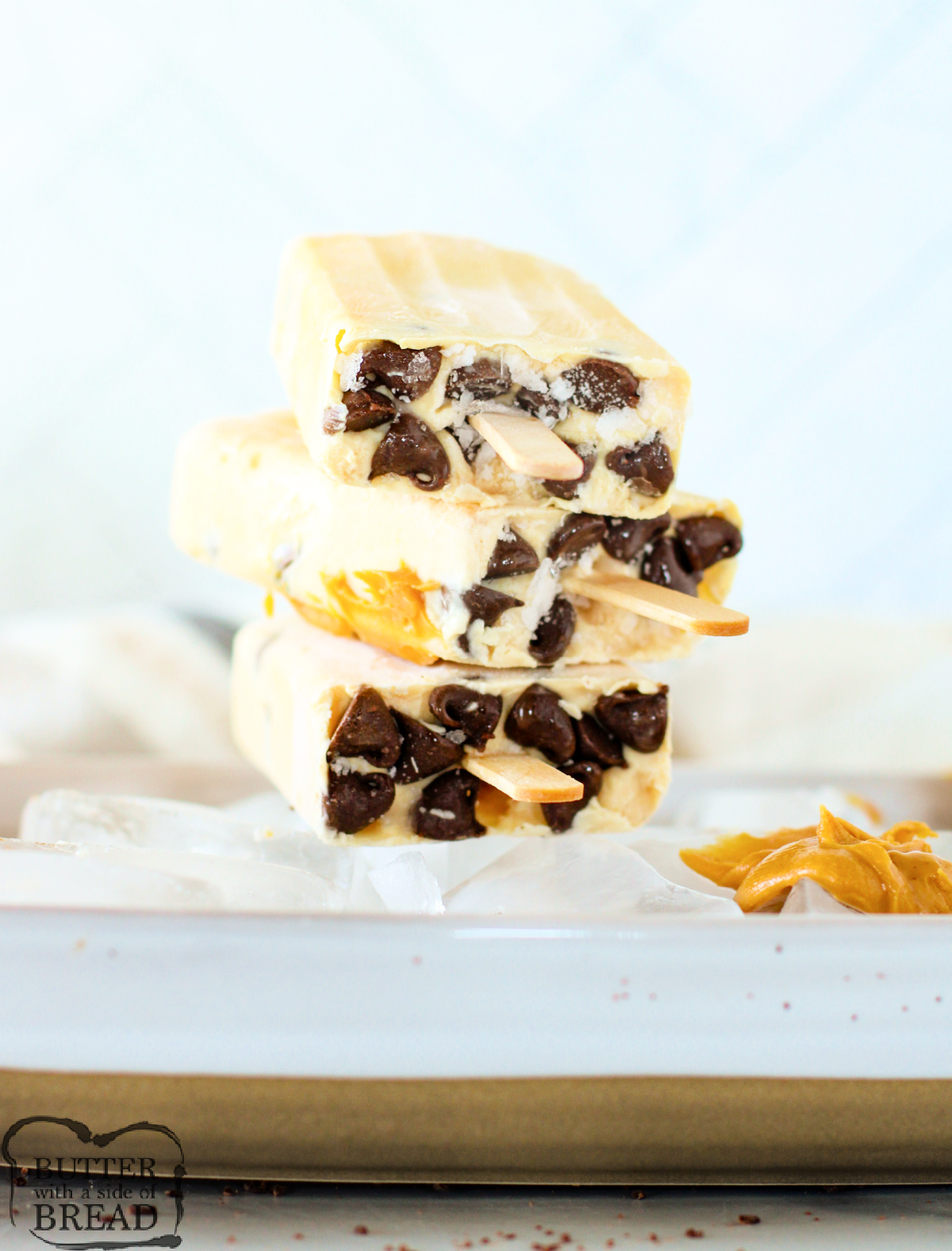 Chocolate Peanut Butter Frozen Yogurt Bars are the perfect healthy-ish frozen treat! Creamy yogurt, peanut butter, and chocolate chips make this easy no-bake recipe a summer favorite.