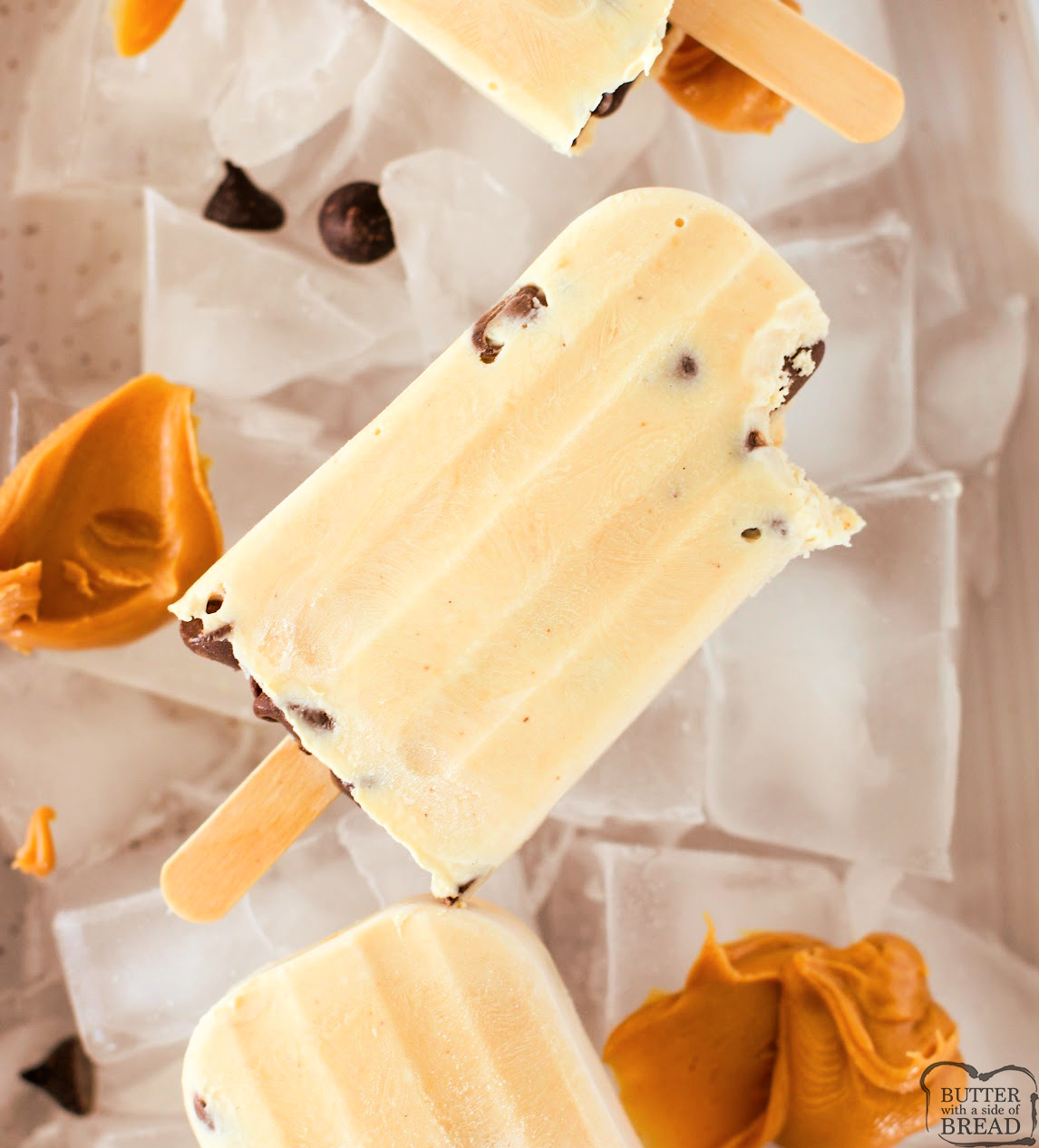 Chocolate Peanut Butter Frozen Yogurt Bars are the perfect healthy-ish frozen treat! Creamy yogurt, peanut butter, and chocolate chips make this easy no-bake recipe a summer favorite.
