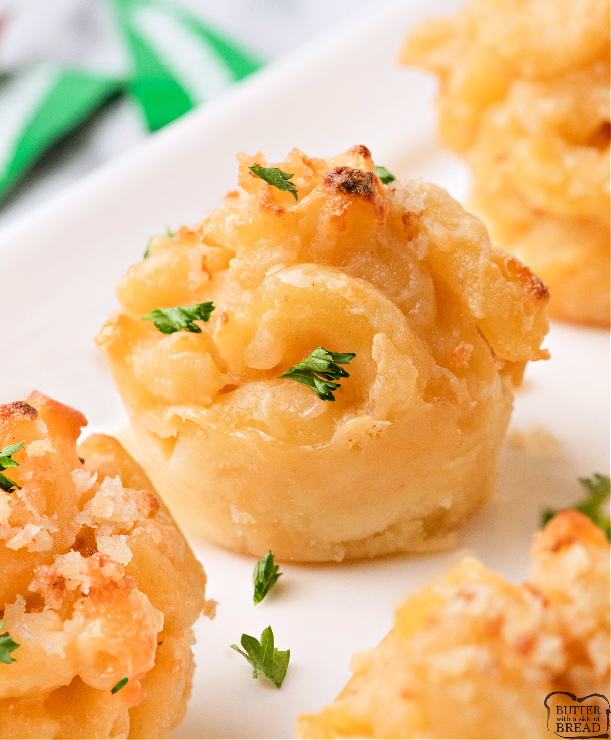Golden brown mac and cheese bite with crispy panko topping and creamy cheese center.
