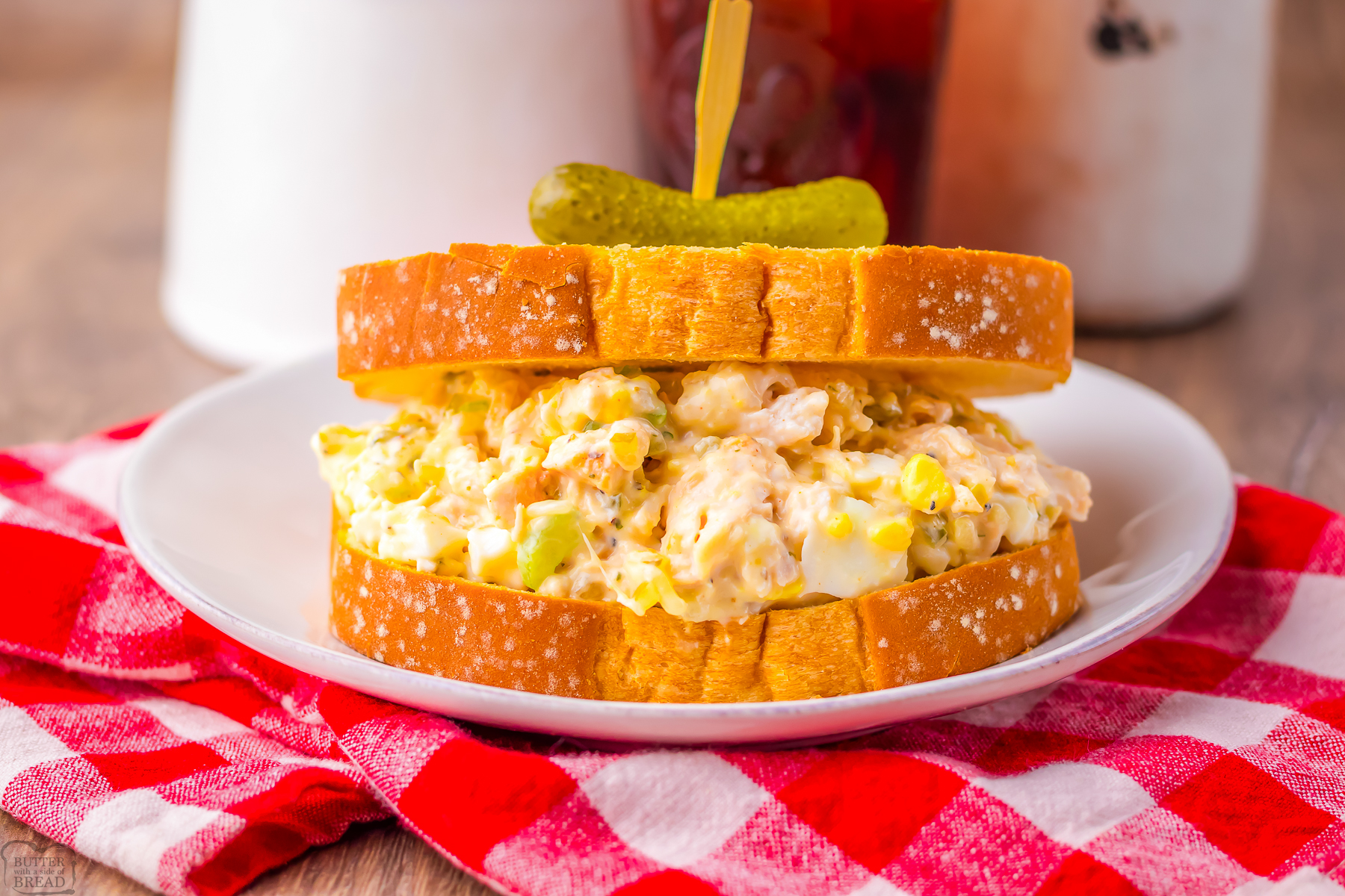 old fashioned southern chicken salad on wheat bread with a pickle