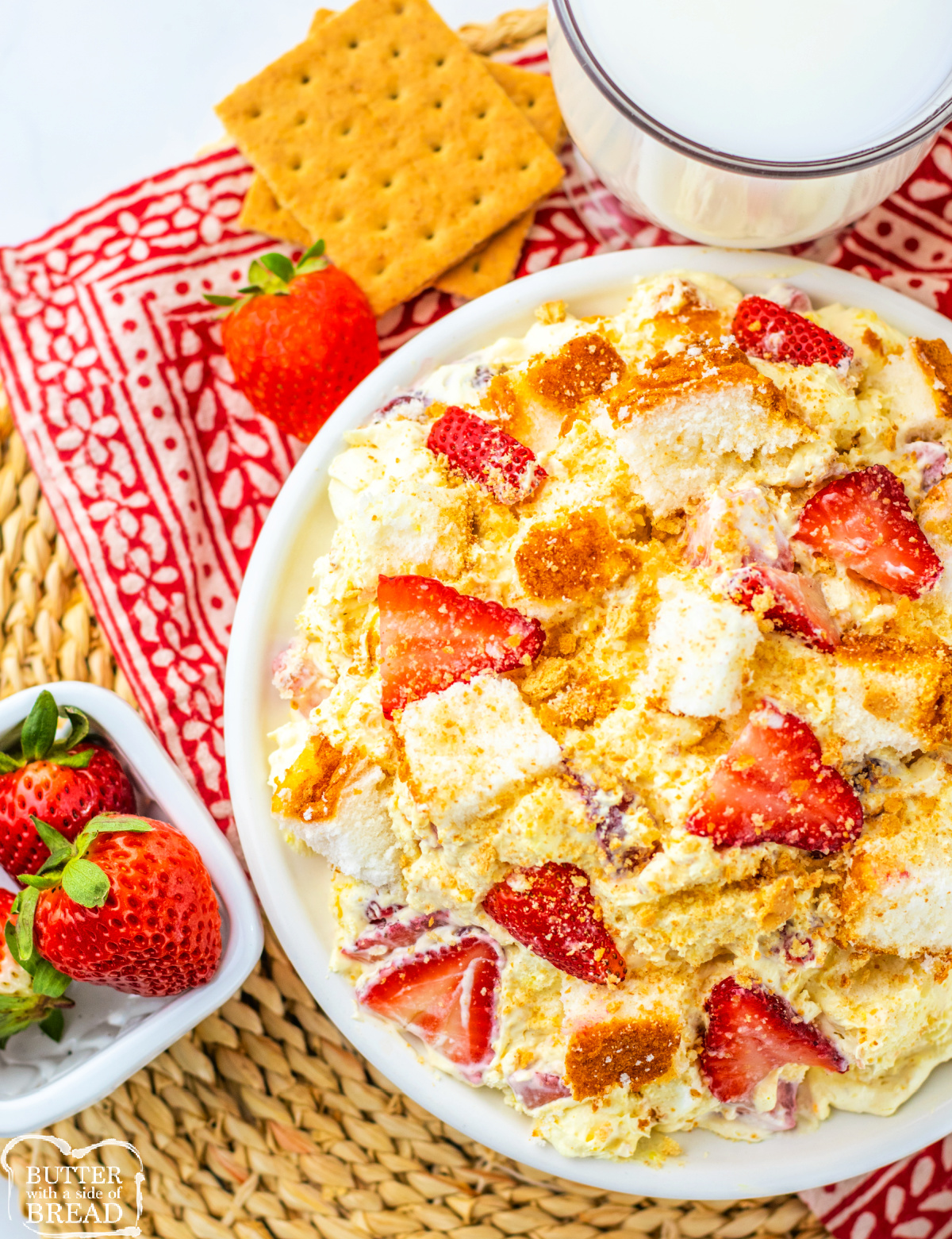 Strawberry Shortcake Fluff Salad is a quick no-bake dessert made with pudding, whipped topping, strawberries, angel food cake & marshmallows!