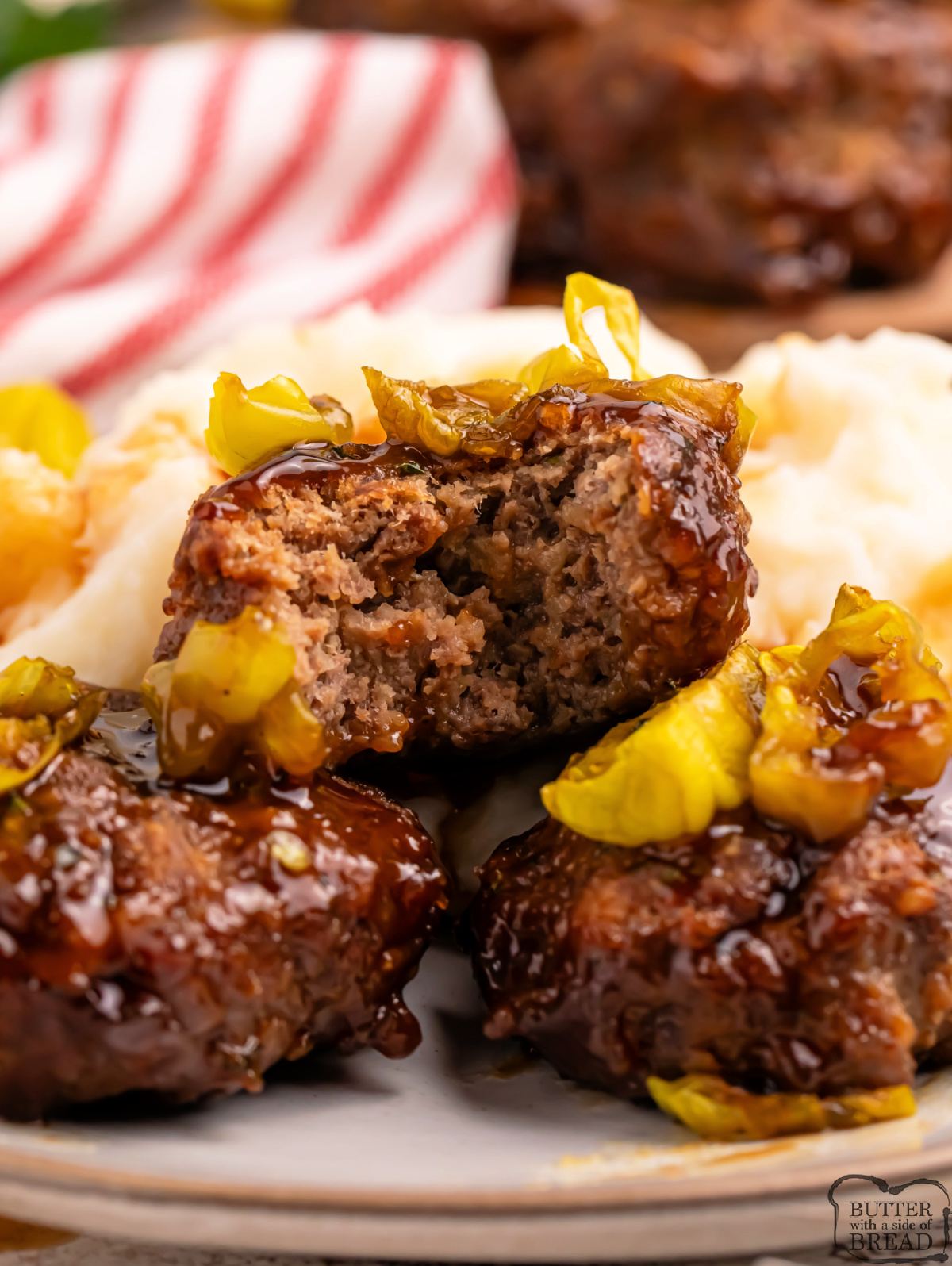 Mississippi Meatloaf Muffins are mini meatloaves baked in a muffin tin, topped with savory gravy sauce and tangy banana peppers.