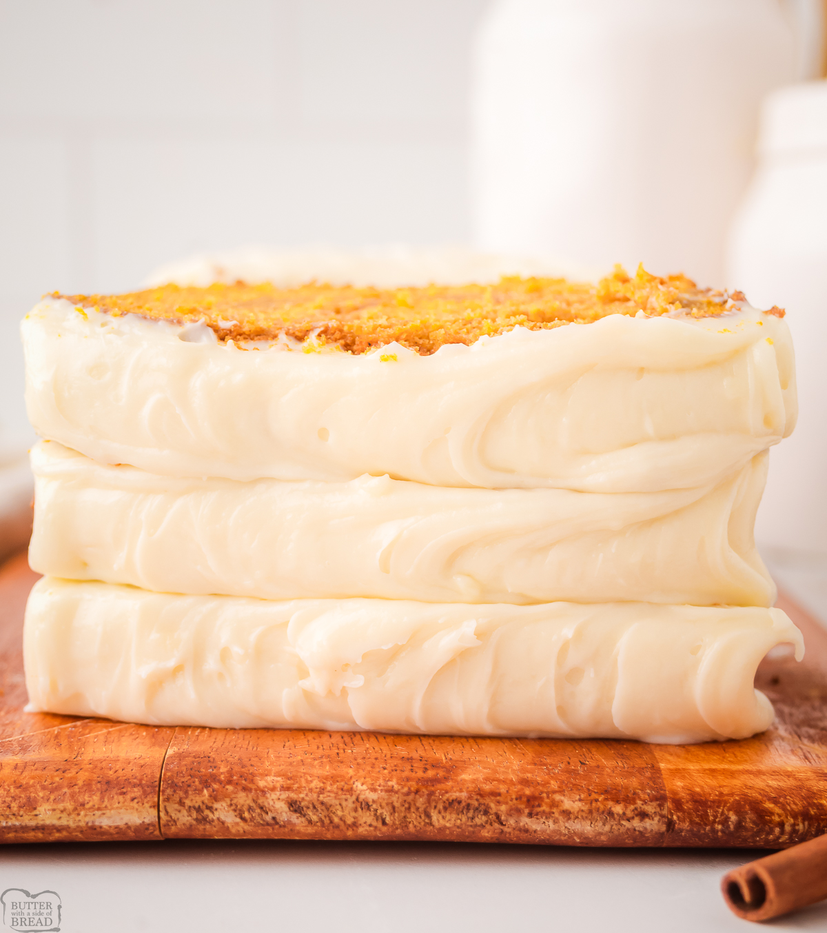 stack of pieces of pumpkin bread topped with cream cheese frosting
