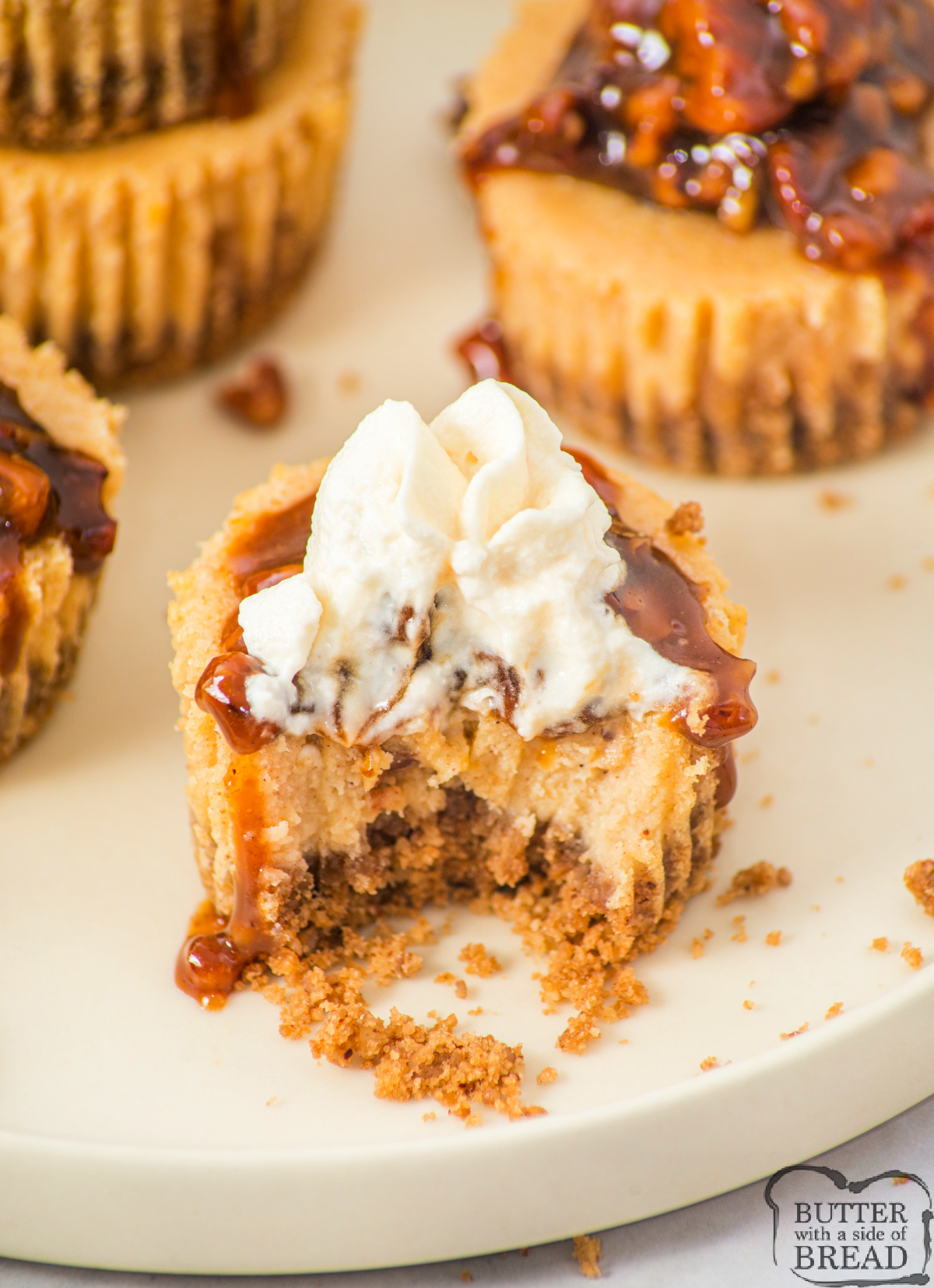 Creamy mini pecan pie cheesecakes with graham cracker crust.