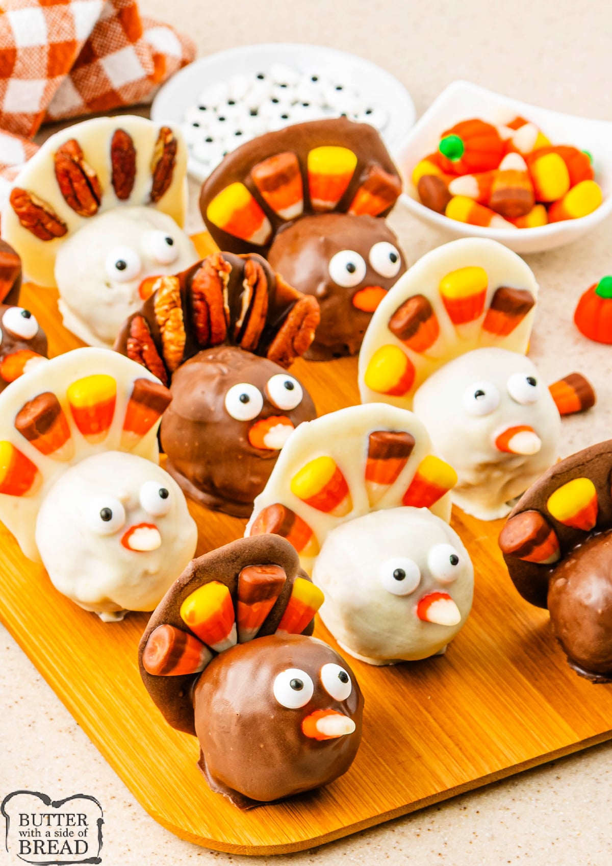 No-Bake Pumpkin Pie Balls decorated as turkeys with candy eyes and candy corn feathers.