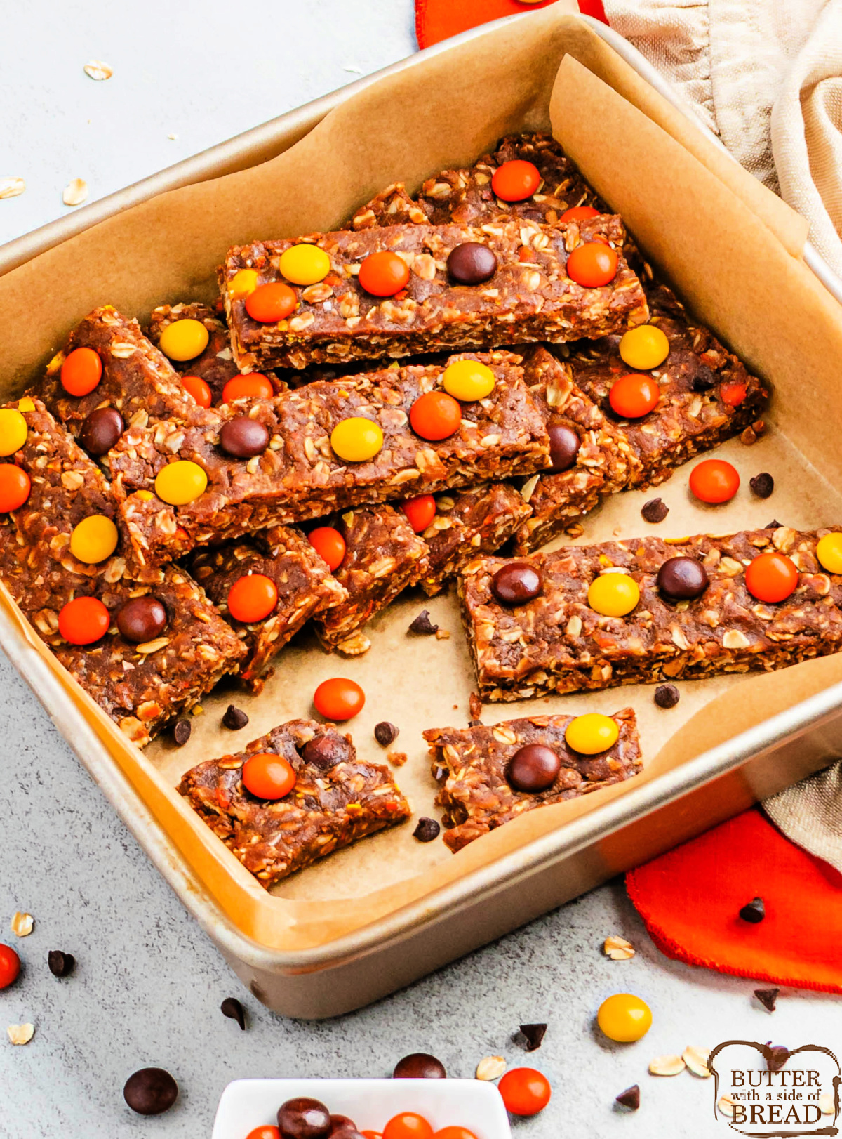 No-Bake Reese’s Protein Bars combine peanut butter, oats, protein powder, and candy crunch for a healthy, chocolatey fall snack!