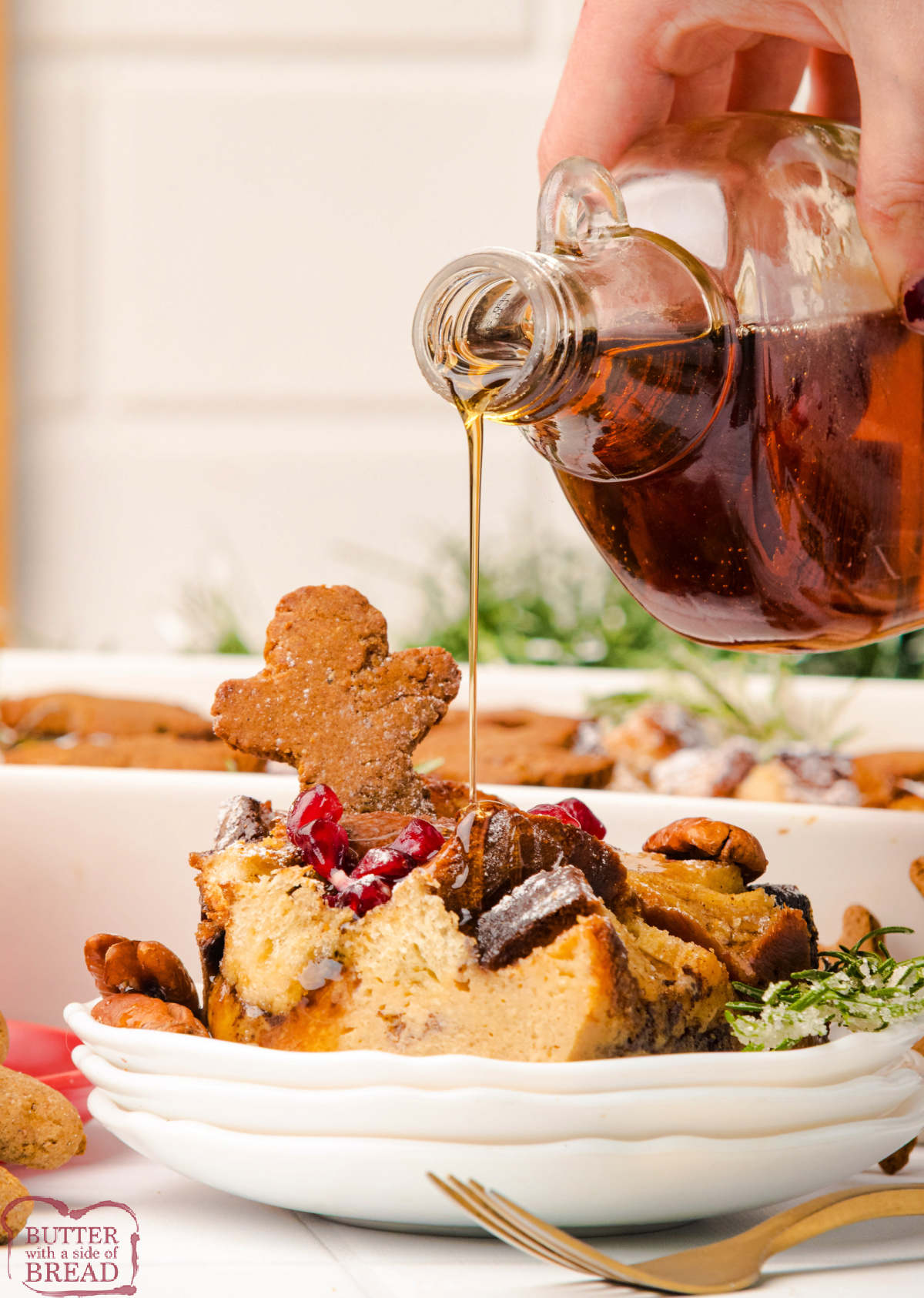 Gingerbread French Toast Casserole served warm with maple syrup and powdered sugar.