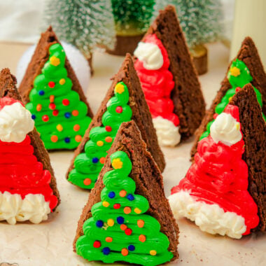 Easy frosted Christmas Brownies on a white plate