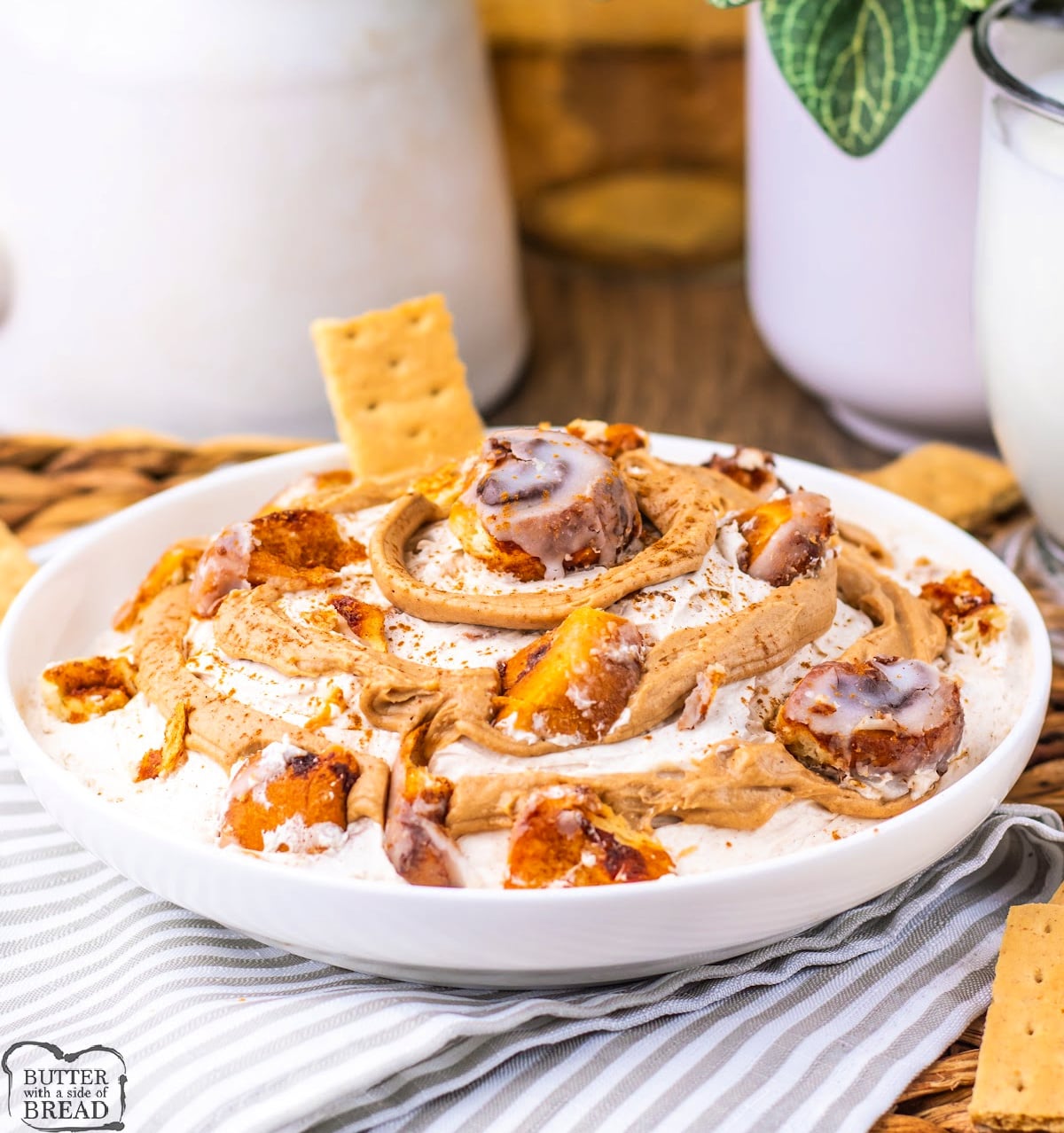 Cinnamon roll dip with icing drizzle, served with graham crackers for dipping.