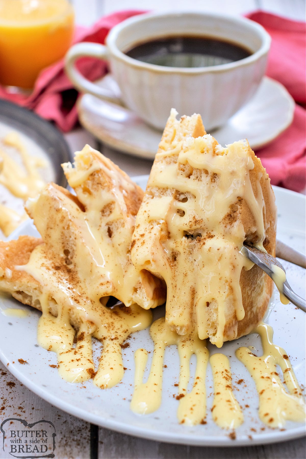Holiday eggnog pancakes smothered in eggnog glaze and cinnamon.