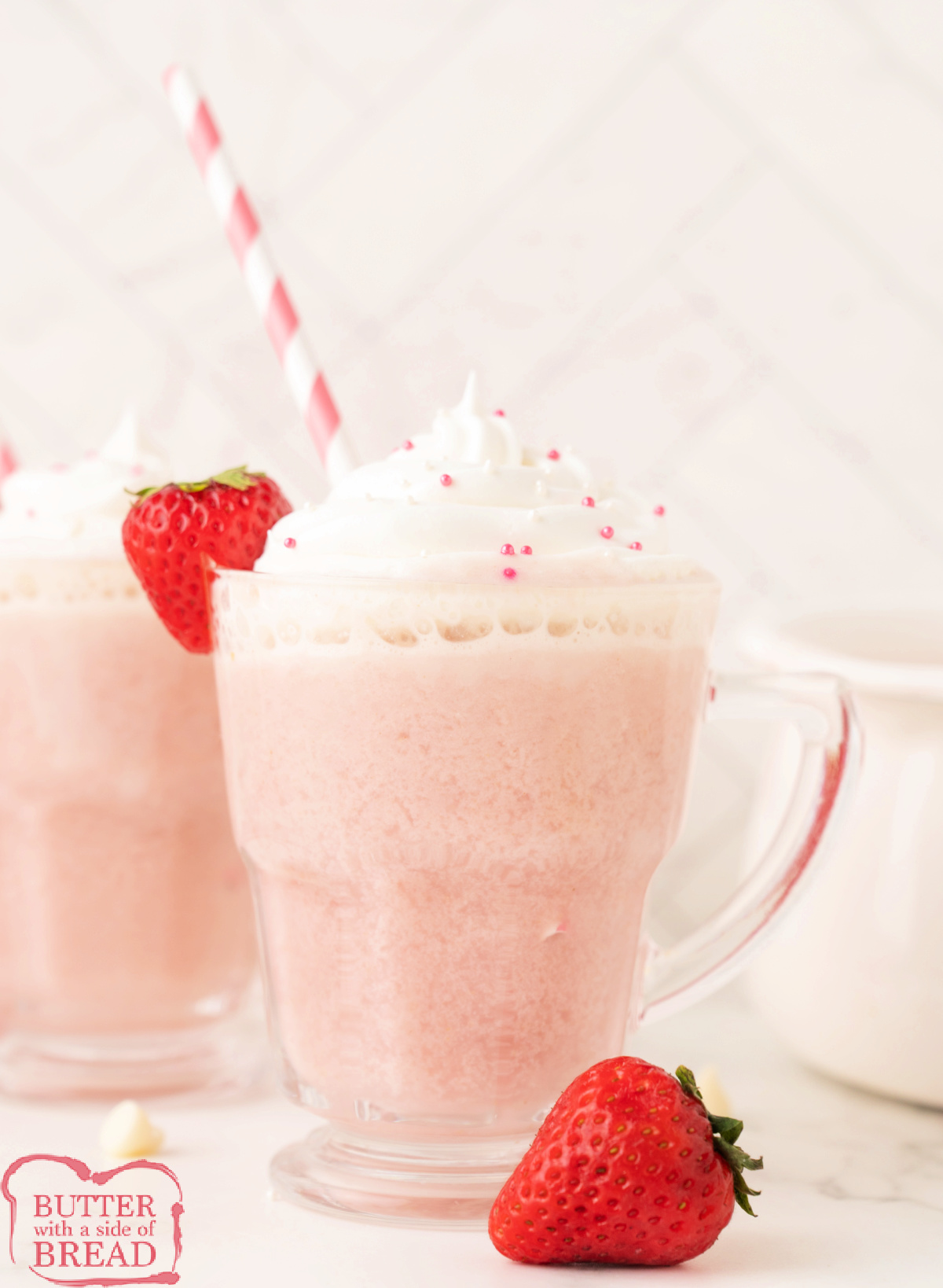 A mug of strawberry hot chocolate made with fresh strawberries and white chocolate.