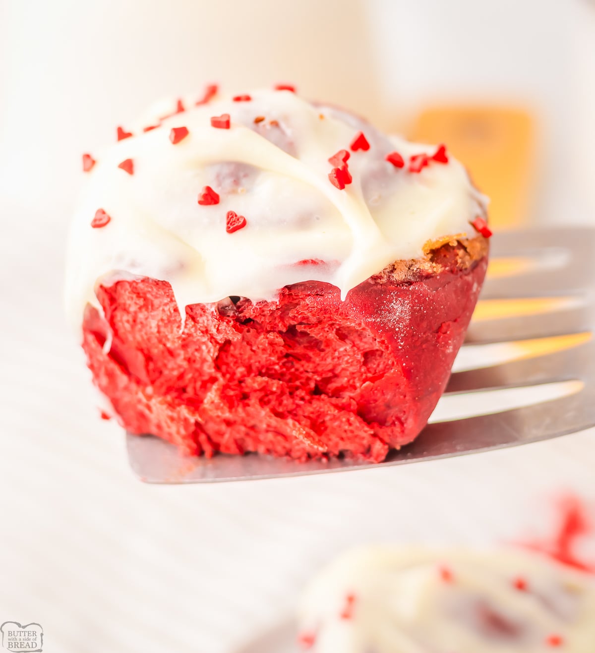 red velvet cinnamon roll being served